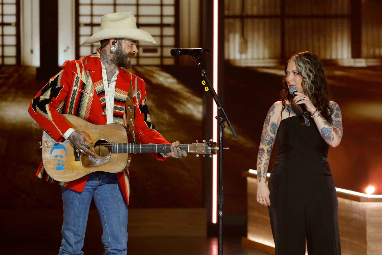 Post Malone and Ashley McBryde perform during Opry 100: A Live Celebration” at Grand Ole Opry on March 19, 2025, in Nashville, Tennessee | Source: Getty Images