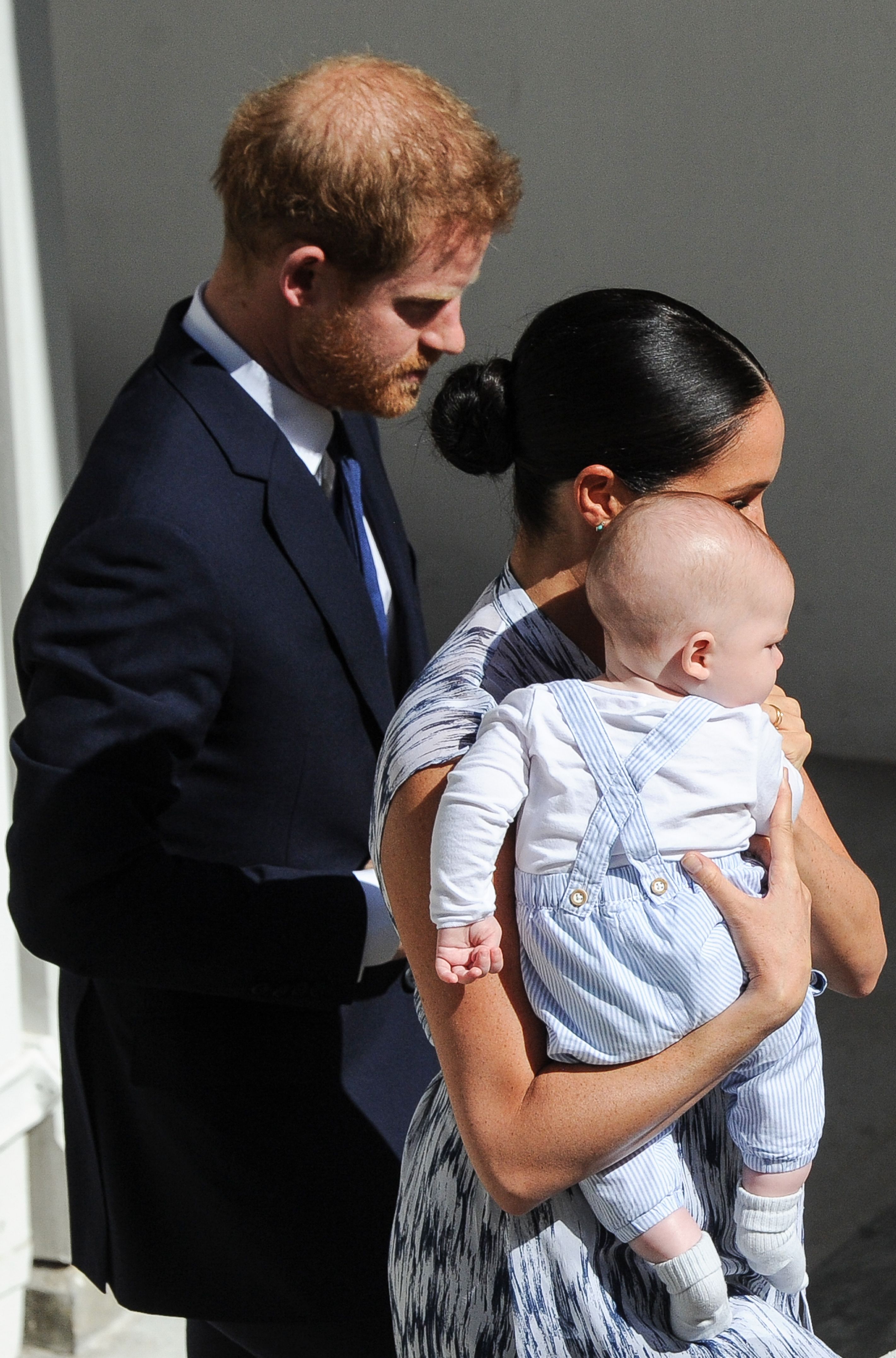 Britain's Duke and Duchess of Sussex, Prince Harry and his wife Meghan hold their baby son Archie as they meet with Archbishop Desmond Tutu and his wife (unseen) at the Tutu Legacy Foundation in Cape Town on September 25, 2019 | Source: Getty Images