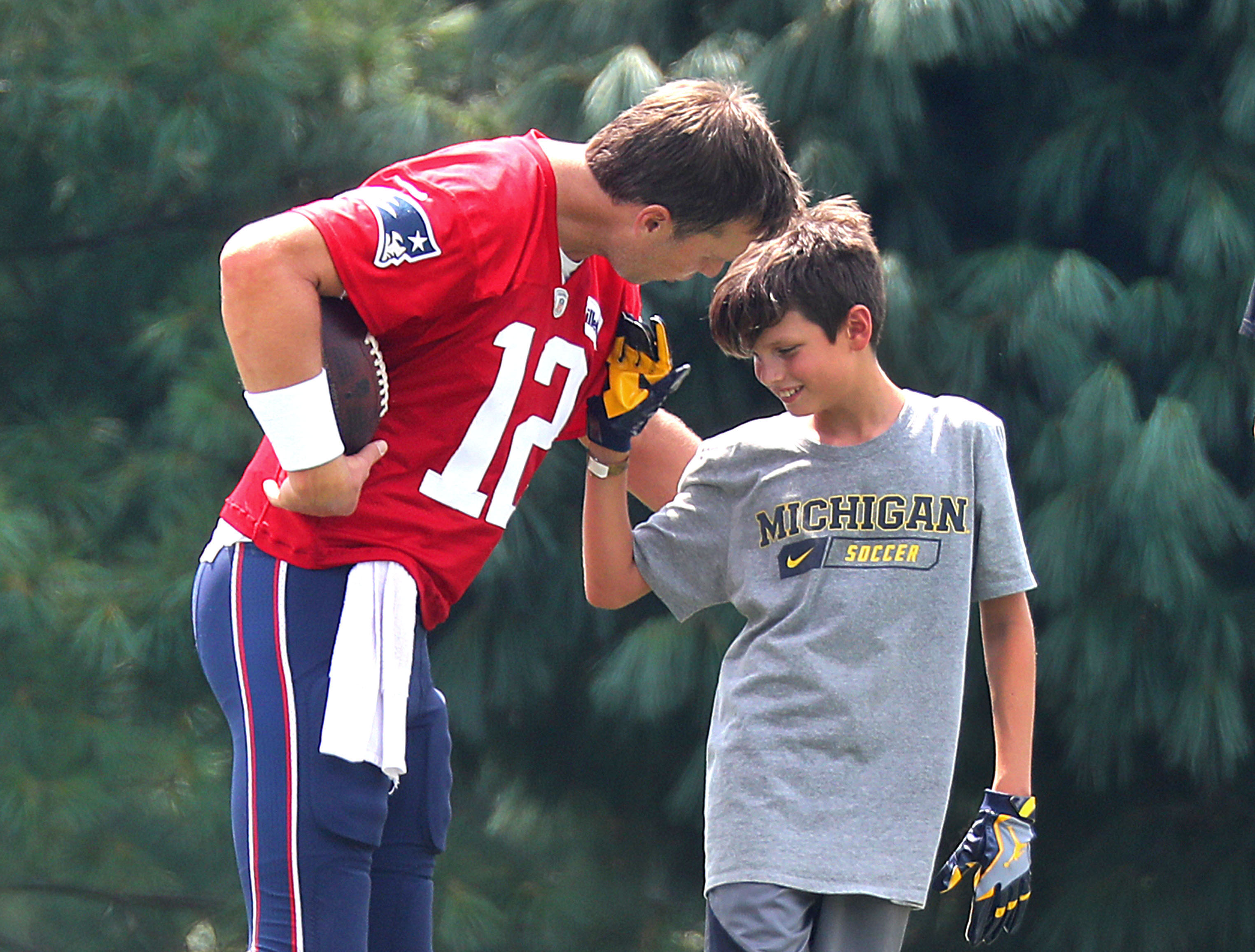 Tom Brady and Jack Moynahan after New England Patriots training camp at the Gillette Stadium practice facility in Foxborough, Massachusetts on August 7, 2018 | Source: Getty Images