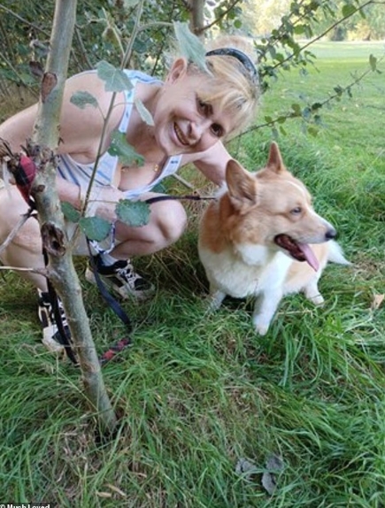 Jennifer Abbott is pictured crouching beside her corgi outdoors, smiling at the camera in a relaxed setting. | Source: X/TrueCrimeUpdate