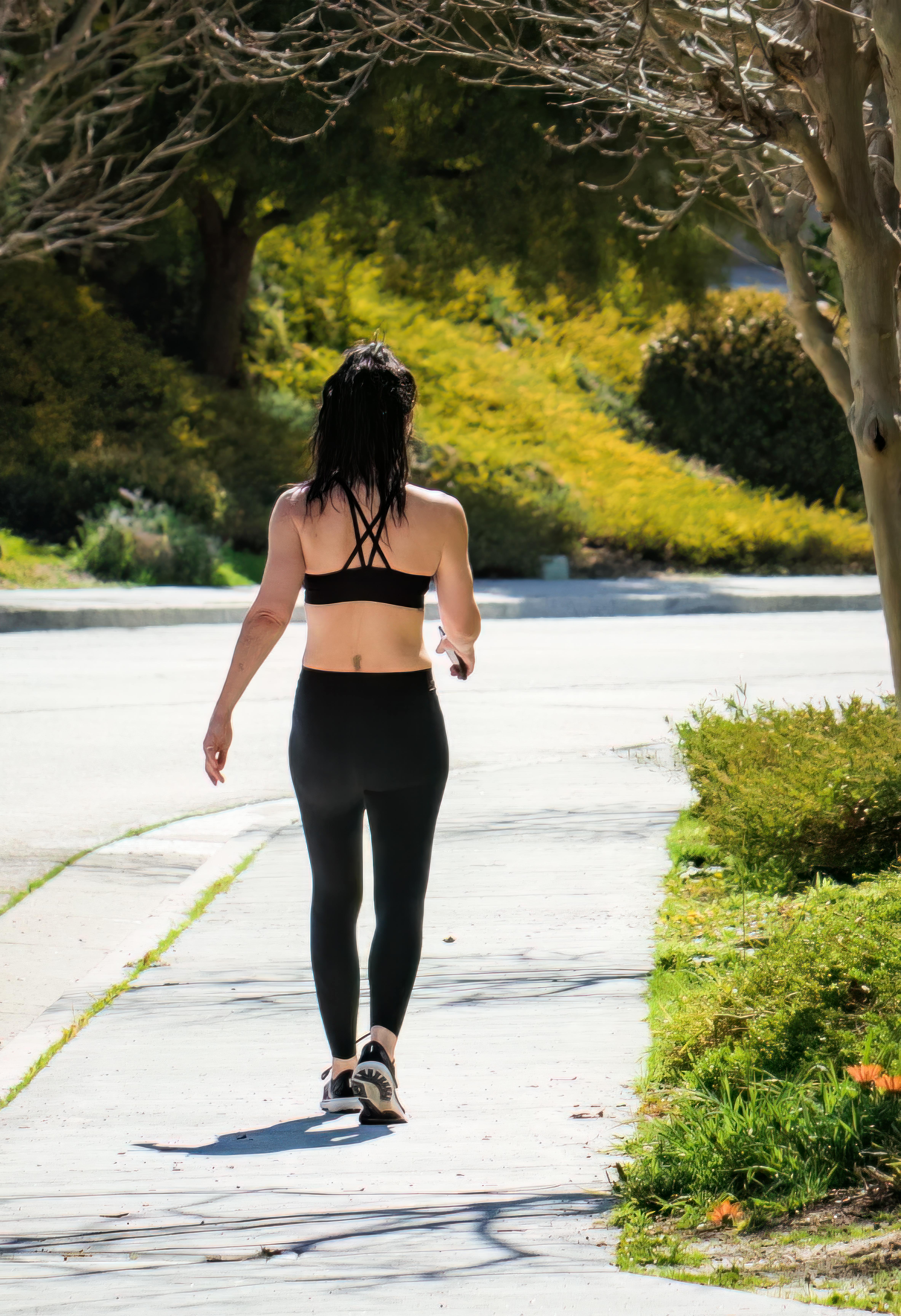 A woman walking outdoors | Source: Pexels