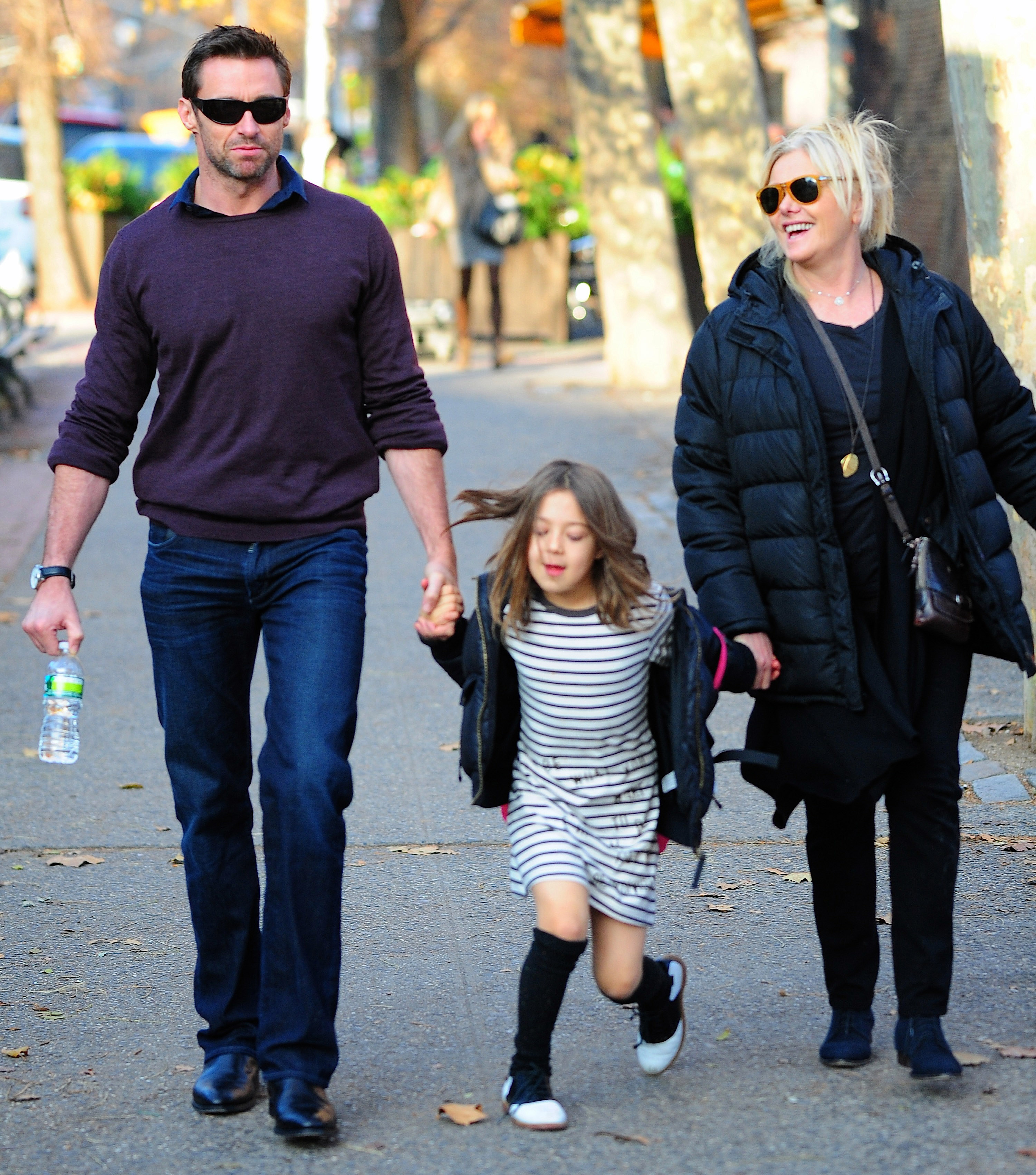 Hugh Jackman, Ava Eliot Jackman, and Deborra-Lee Furness walk in New York City on December 3, 2012 | Source: Getty Images