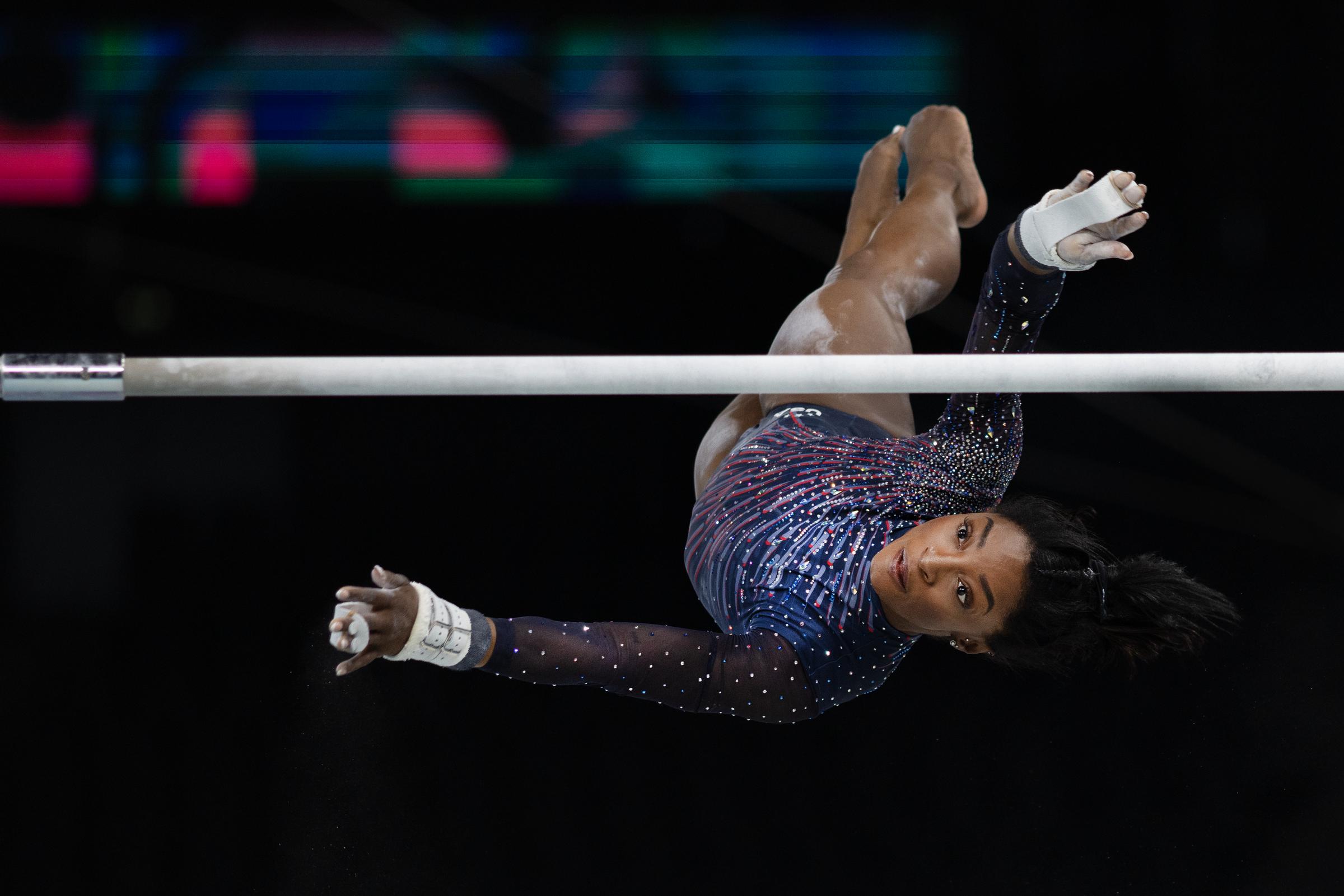 Simone Biles performs her uneven bars routine during podium training ahead of the Paris 2024 Olympics at Bercy Arena, Paris, on July 25, 2024 | Source: Getty Images