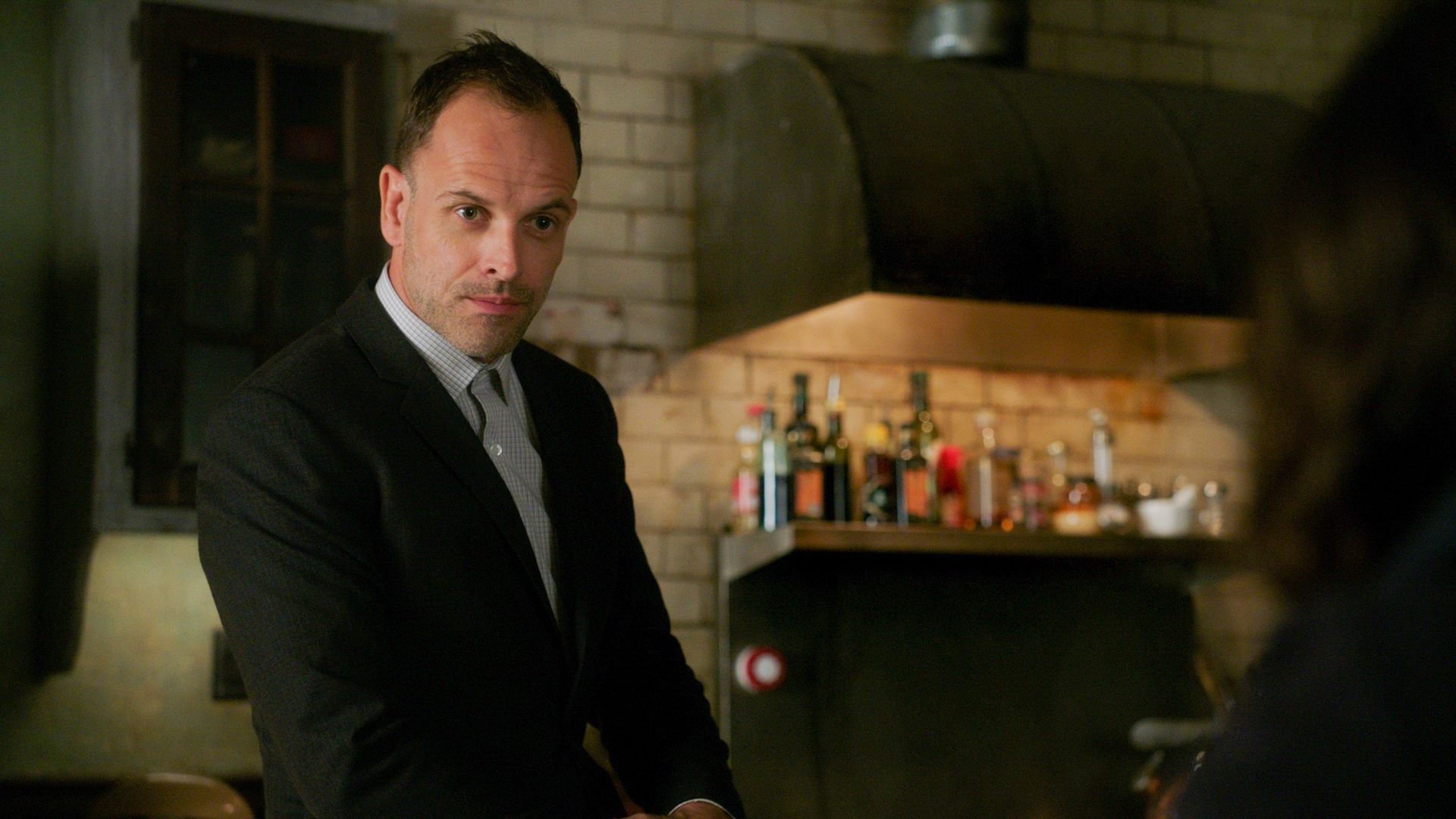 Jonny Lee Miller on the set of "Elementary" | Source: Getty Images