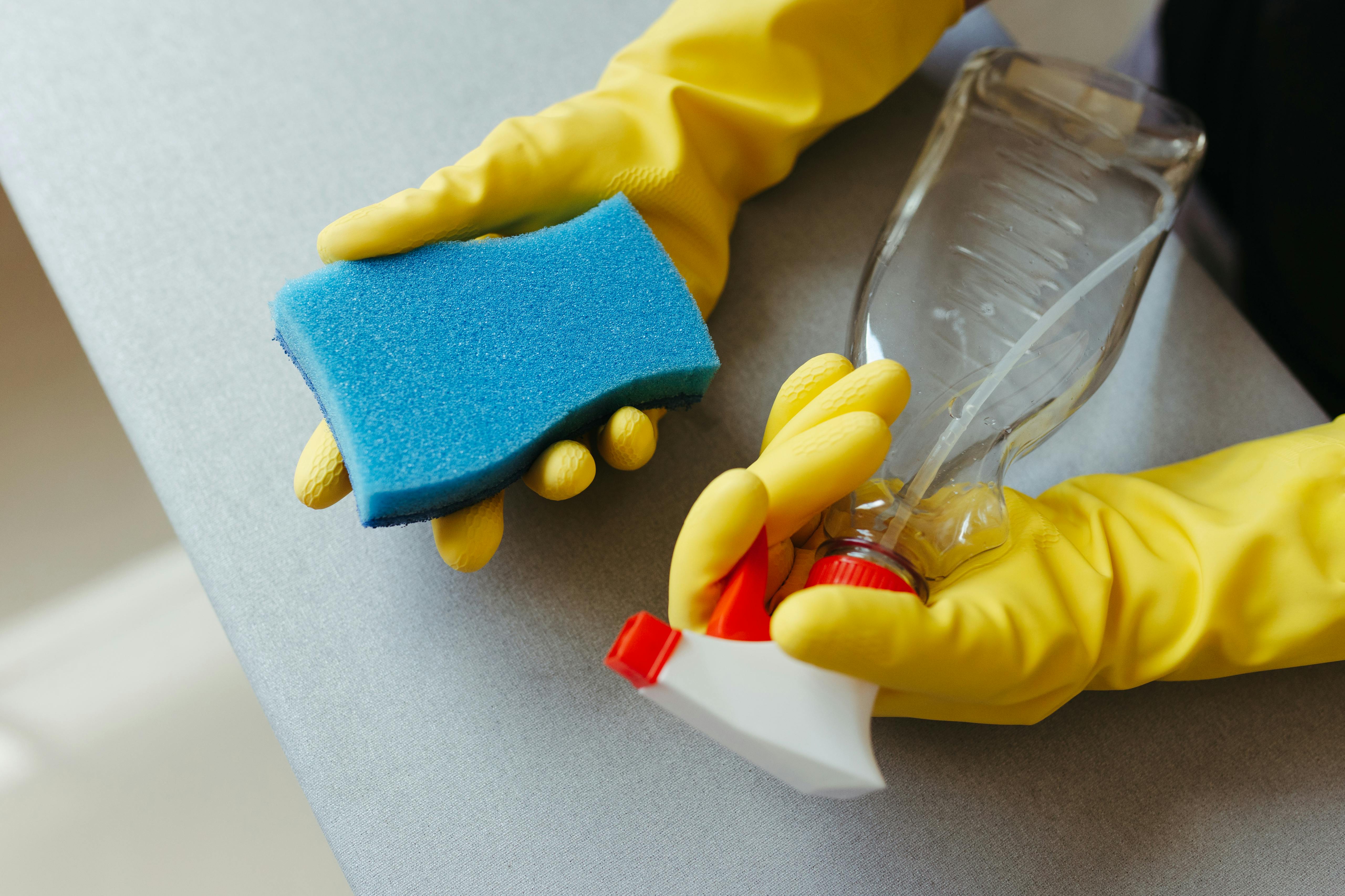 A close-up of a kitchen sponge in use, underscoring the risk of spreading germs across surfaces. | Source: Pexels