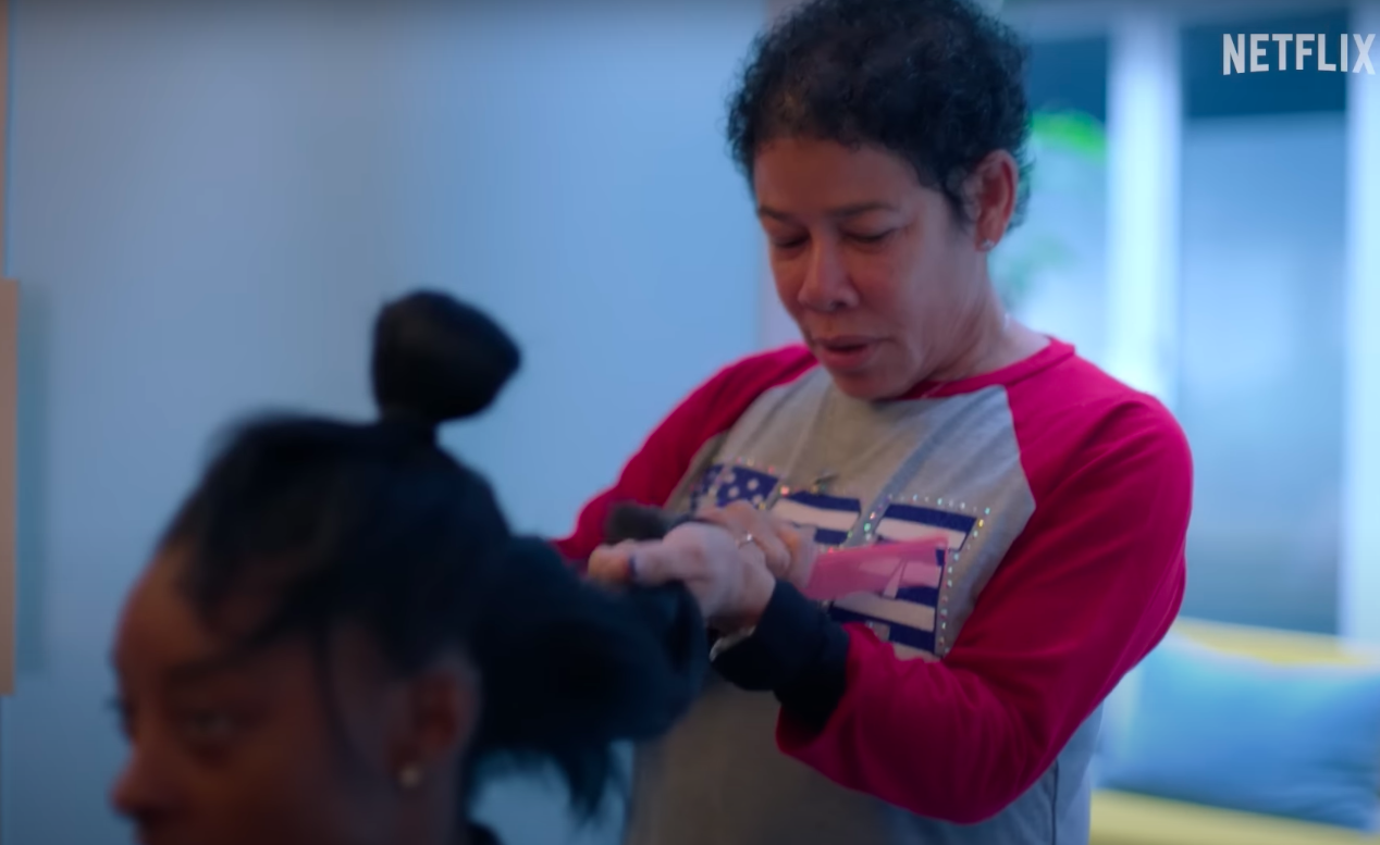 Nellie Biles doing Simone Biles' hair, posted on July 15, 2024 | Source: YouTube/Netflix