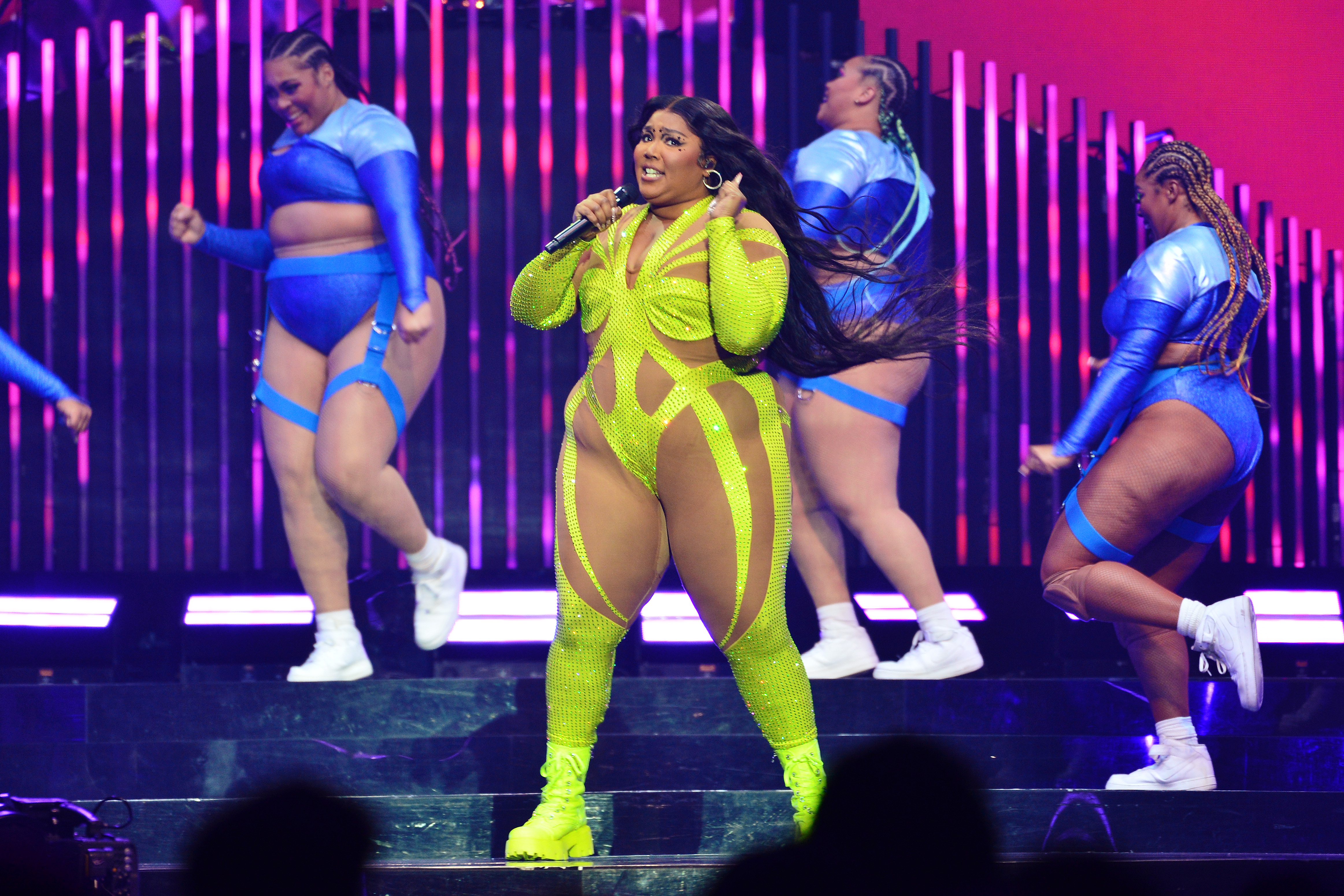 Lizzo and her dancers perform at The O2 Arena on March 15, 2023 in London, England | Source: Getty Images