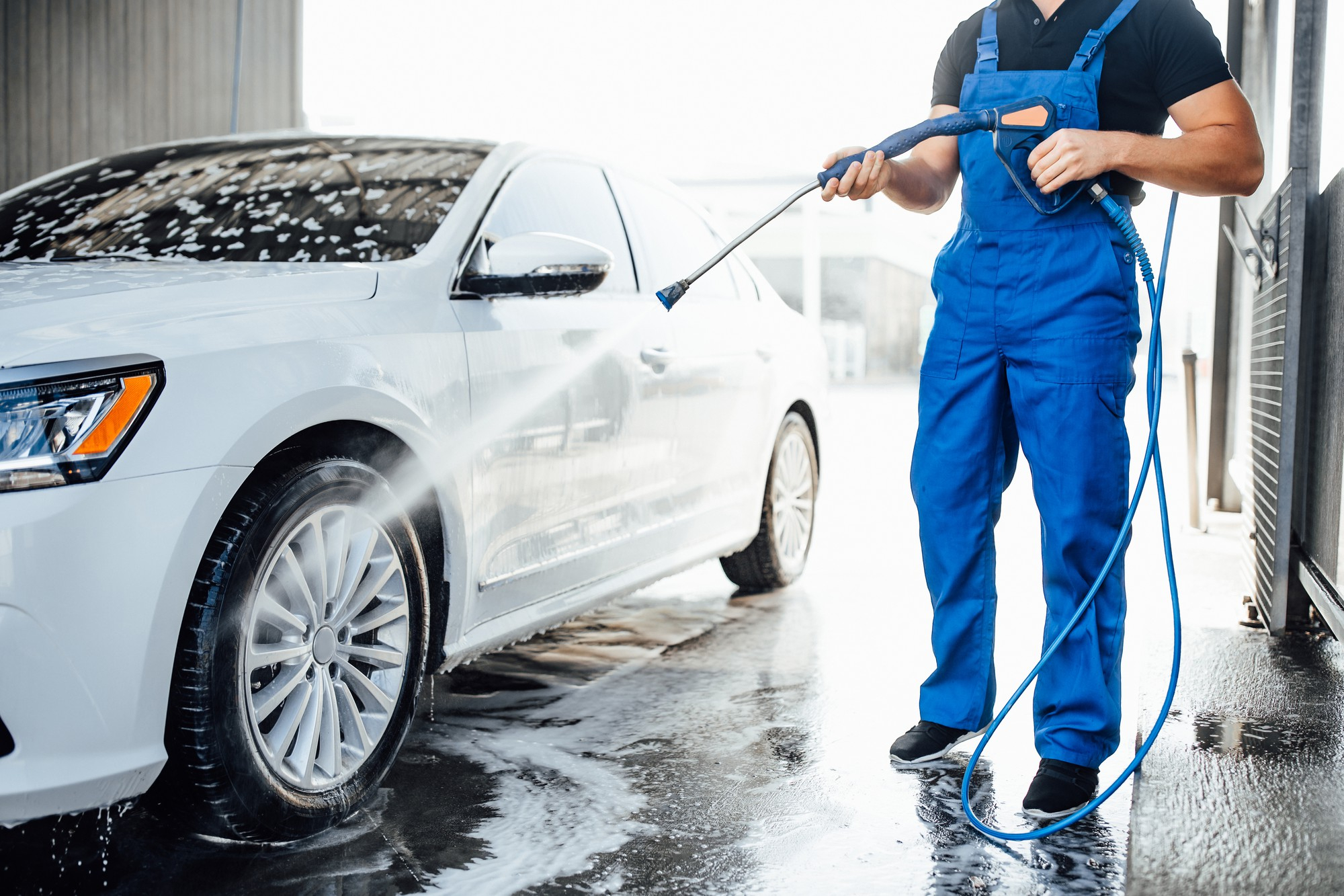A car being cleaned at a car wash | Source: Freepik