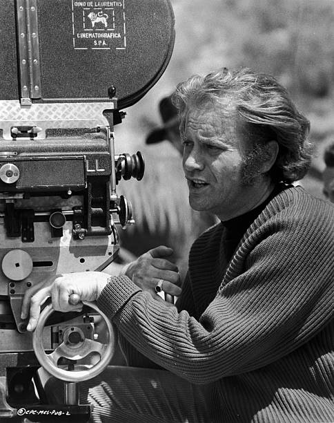 American actor and director Vic Morrow squints while standing behind a motion picture camera outdoors on a film set, circa 1971  | Photo: Getty Images
