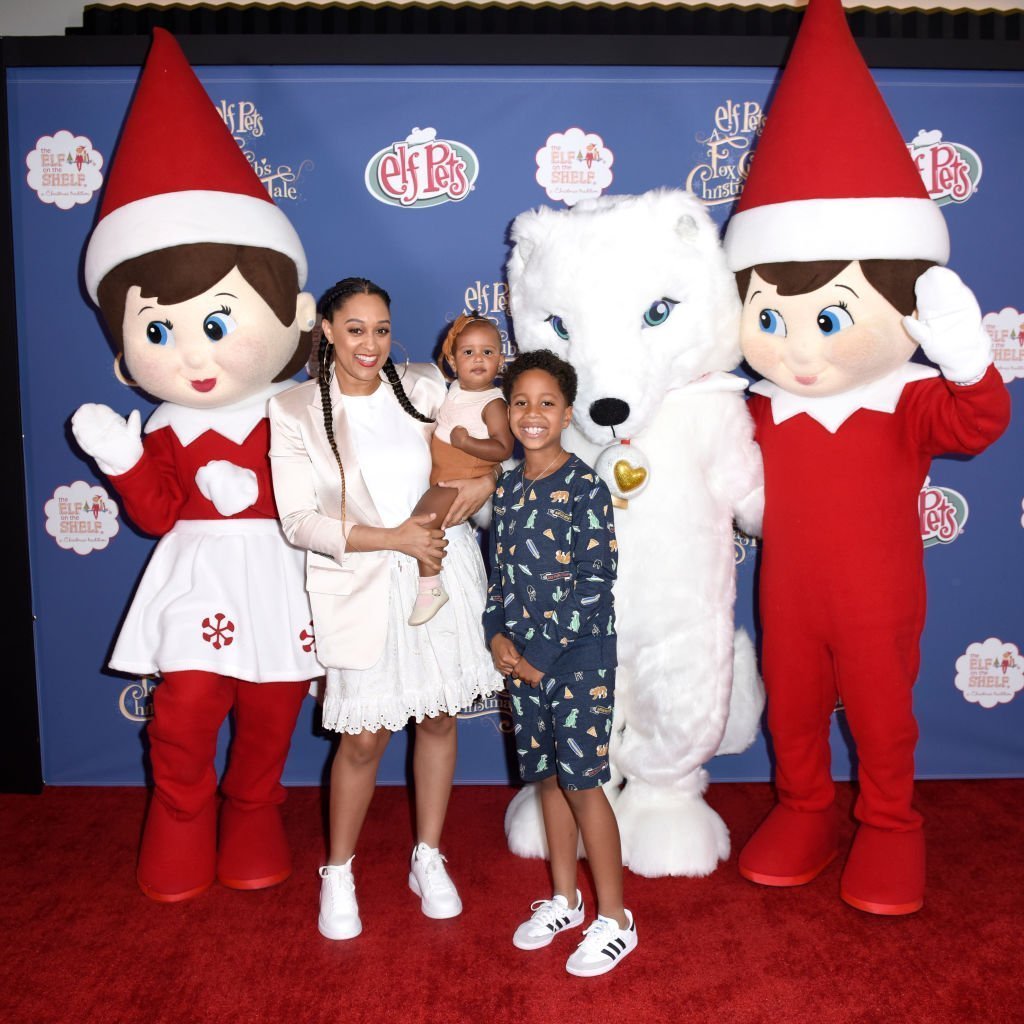 Tia Mowry with her two children, Cree and Cairo Hardrict attending the advanced screening of "Elf Pets: A Fox Club's Christmas Tale" in June 2019. | Photo: Getty Images