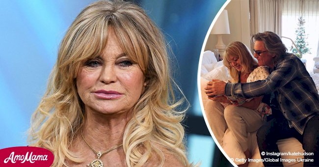 Goldie Hawn pictured in a sweet photo cradling her two-month-old granddaughter