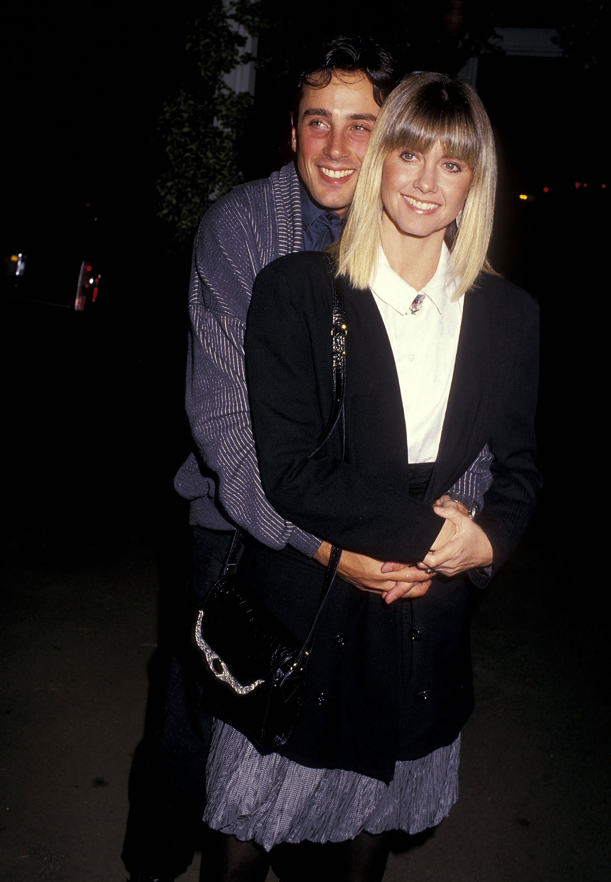 Singer Olivia Newton-John and husband Matt Lattanzi attend the "Siesta" Culver City Premiere on October 29, 1987 at the Cary Grant Theatre in Culver City | Source: Getty Images