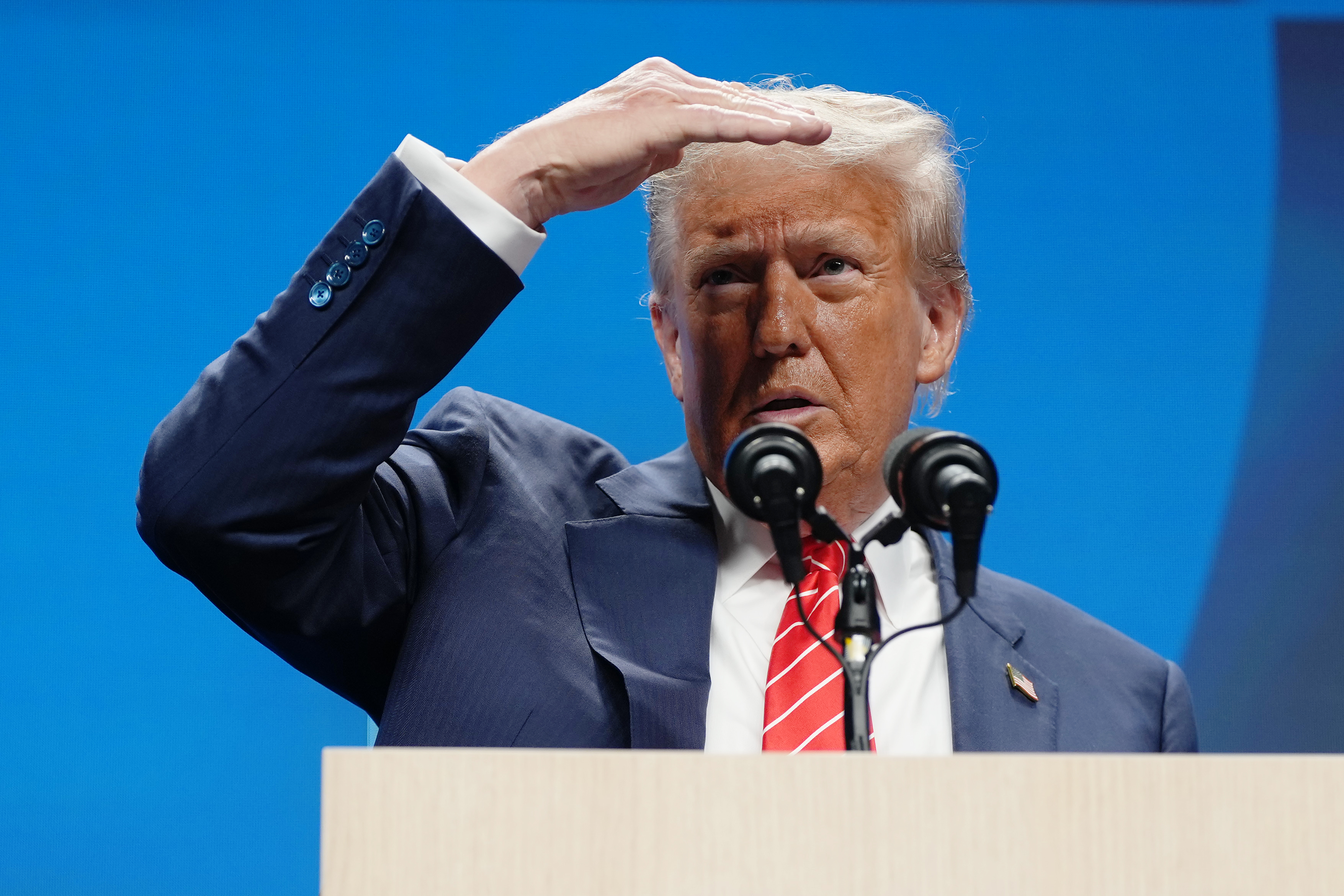 Trump's light-blond hair appeared swept back during the NATO summit in June 2025. A few months later, he criticized a Time cover for how his hair looked in the photo. | Source: Getty Images