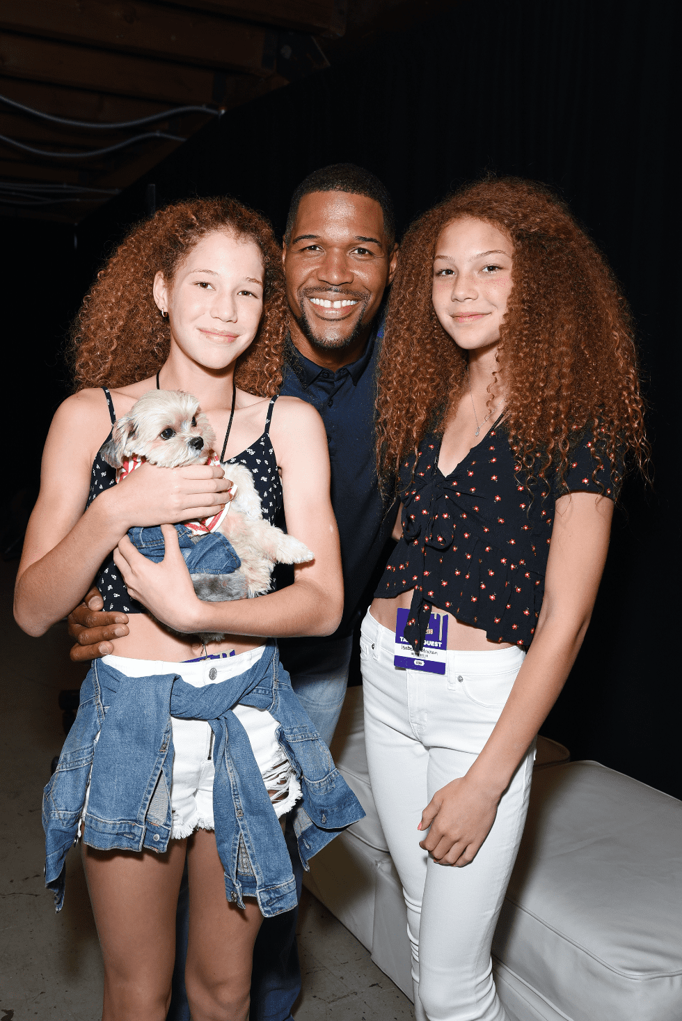 Michael Strahan and his twin daughters, Sophia and Isabella, pose during  at the Nickelodeon Kids' Choice Sports 2018 on July 19, 2018 in Santa Monica, California. | Source: Getty Images