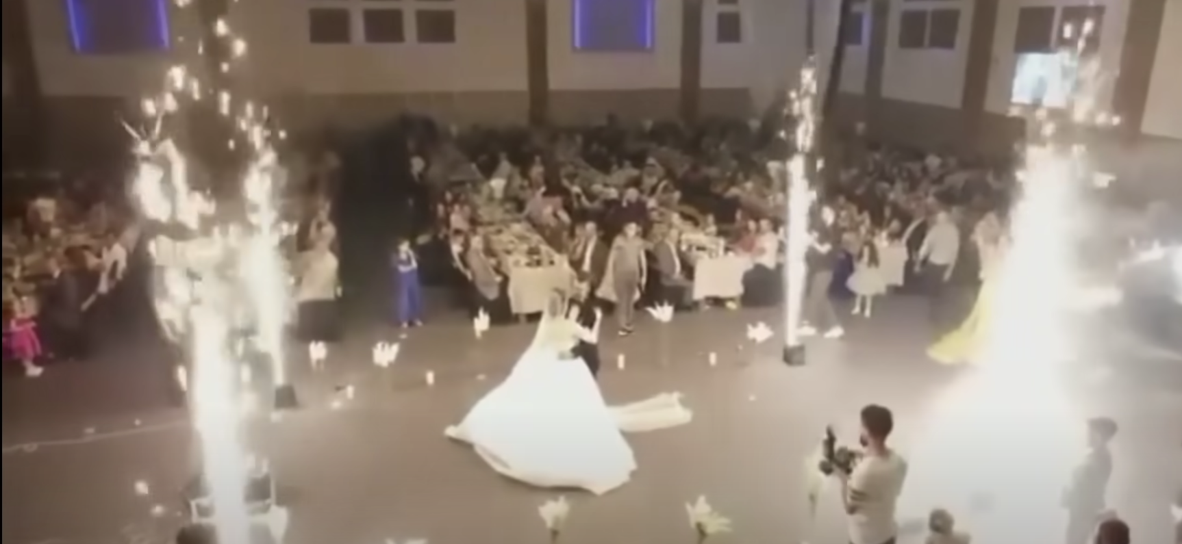 Flares going off as Haneen and Revan Isho danced at their wedding | Source: YouTube.com/@SkyNews