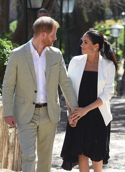 Prince Harry and Meghan walk through the walled public Andalusian Gardens on February 25, 2019, in Rabat, Morocco. | Source: Getty Images.