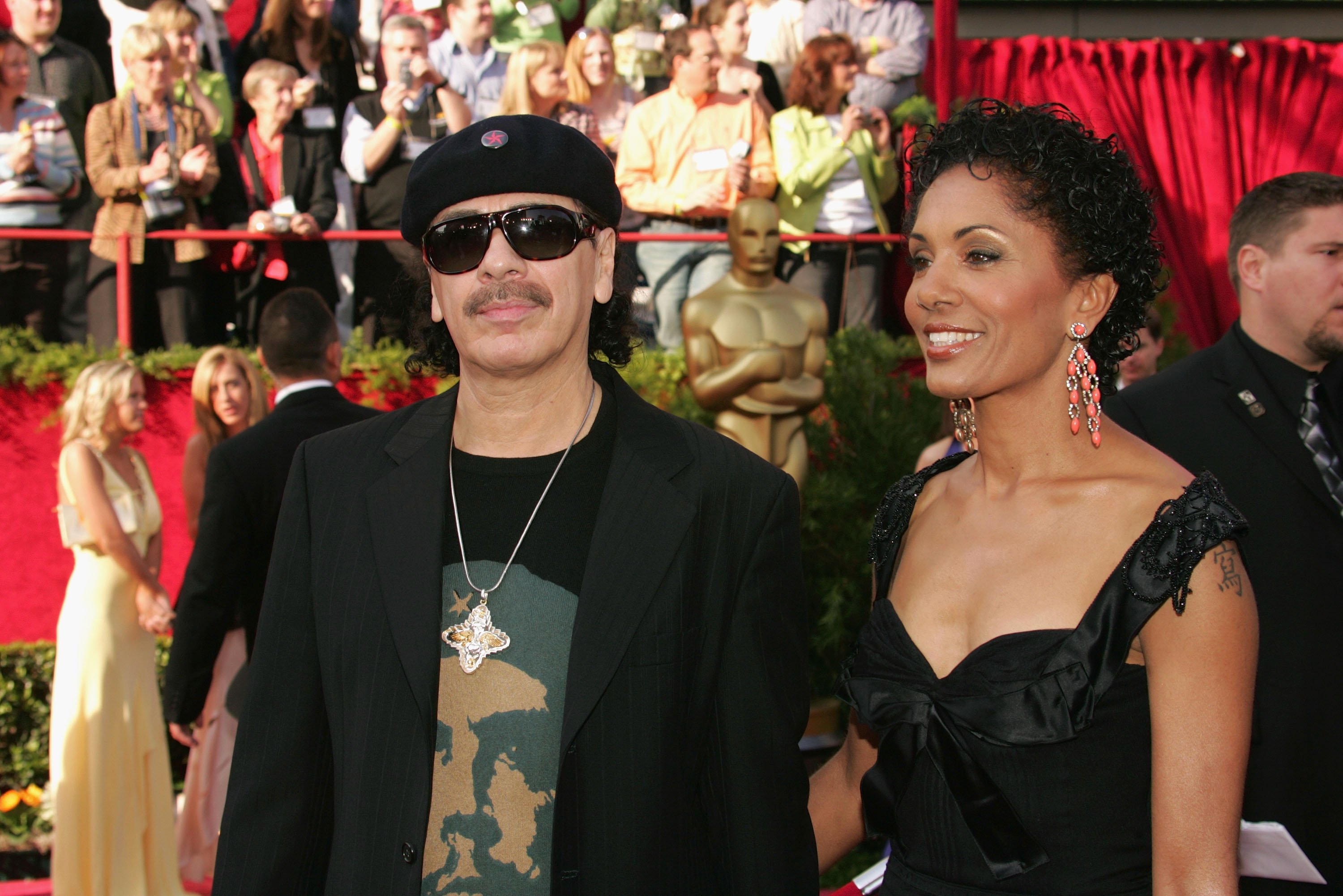 Carlos Santana and Deborah King at the 77th Annual Academy Awards on February 27, 2005 | Source: Getty Images