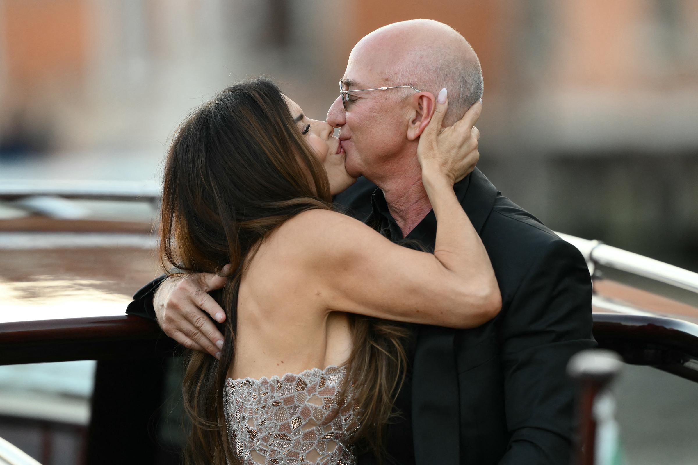 Jeff Bezos and Lauren Sanchez Bezos kiss as they leave the Aman Hotel on the third day of their wedding festivities on June 28, 2025, in Venice, Italy. | Source: Getty Images