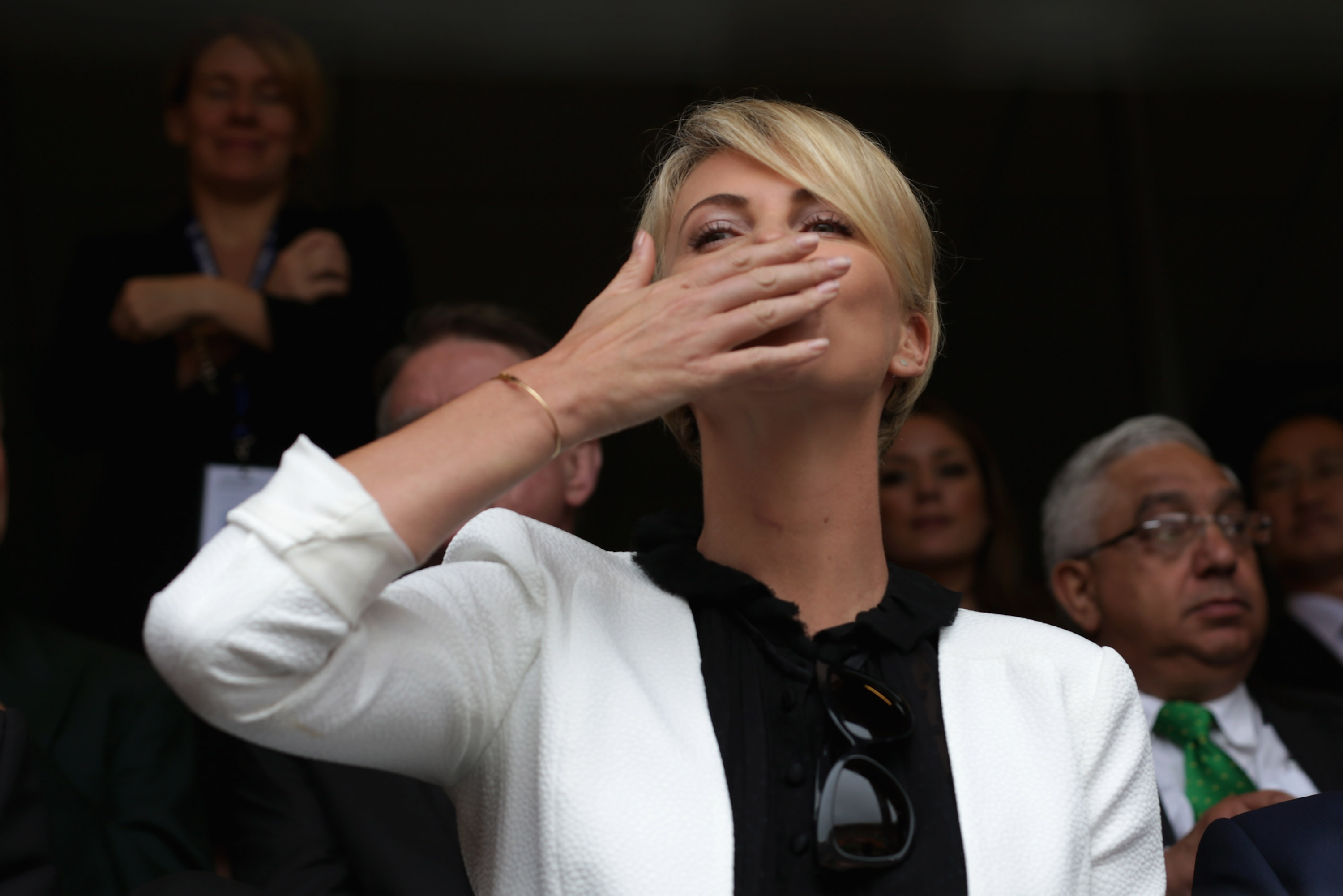 Charlize Theron blows kisses to the audience as she arrives for the official memorial service for former South African President Nelson Mandela at FNB Stadium December 10, 2013 in Johannesburg, South Africa. | Source: Getty Images