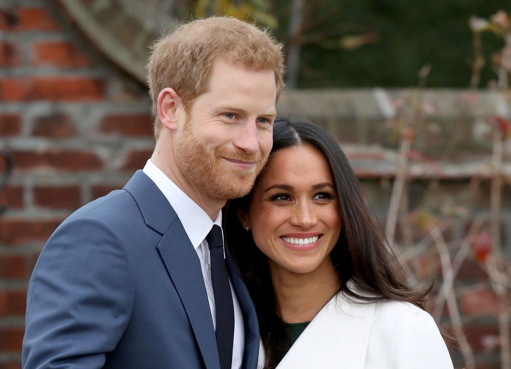 Prince Harry and Meghan Markle at an official photocall to announce their engagement at The Sunken Gardens at Kensington Palace on November 27, 2017 | Photo: Getty Images