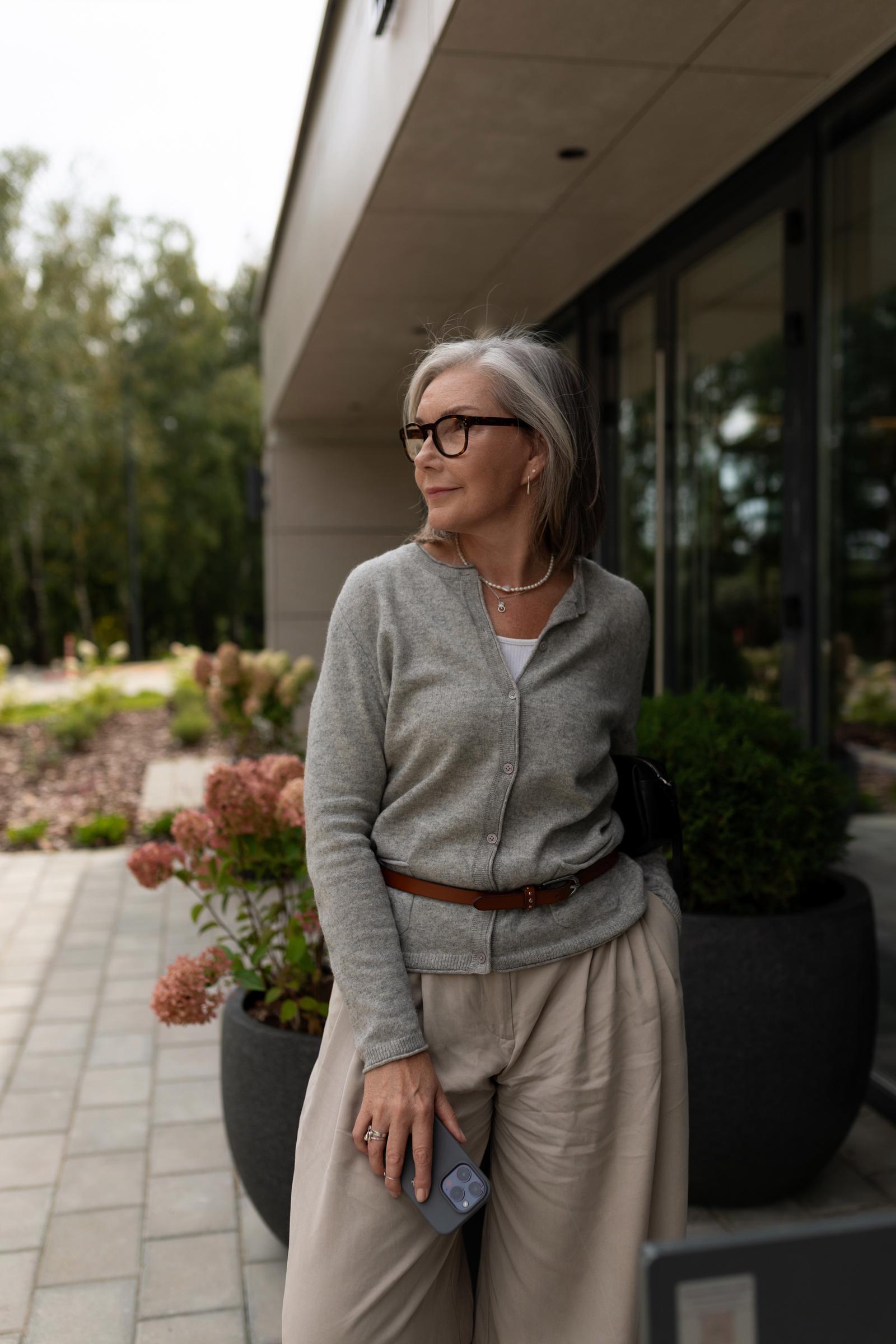 A woman showing off her stylish outfit | Source: Pexels
