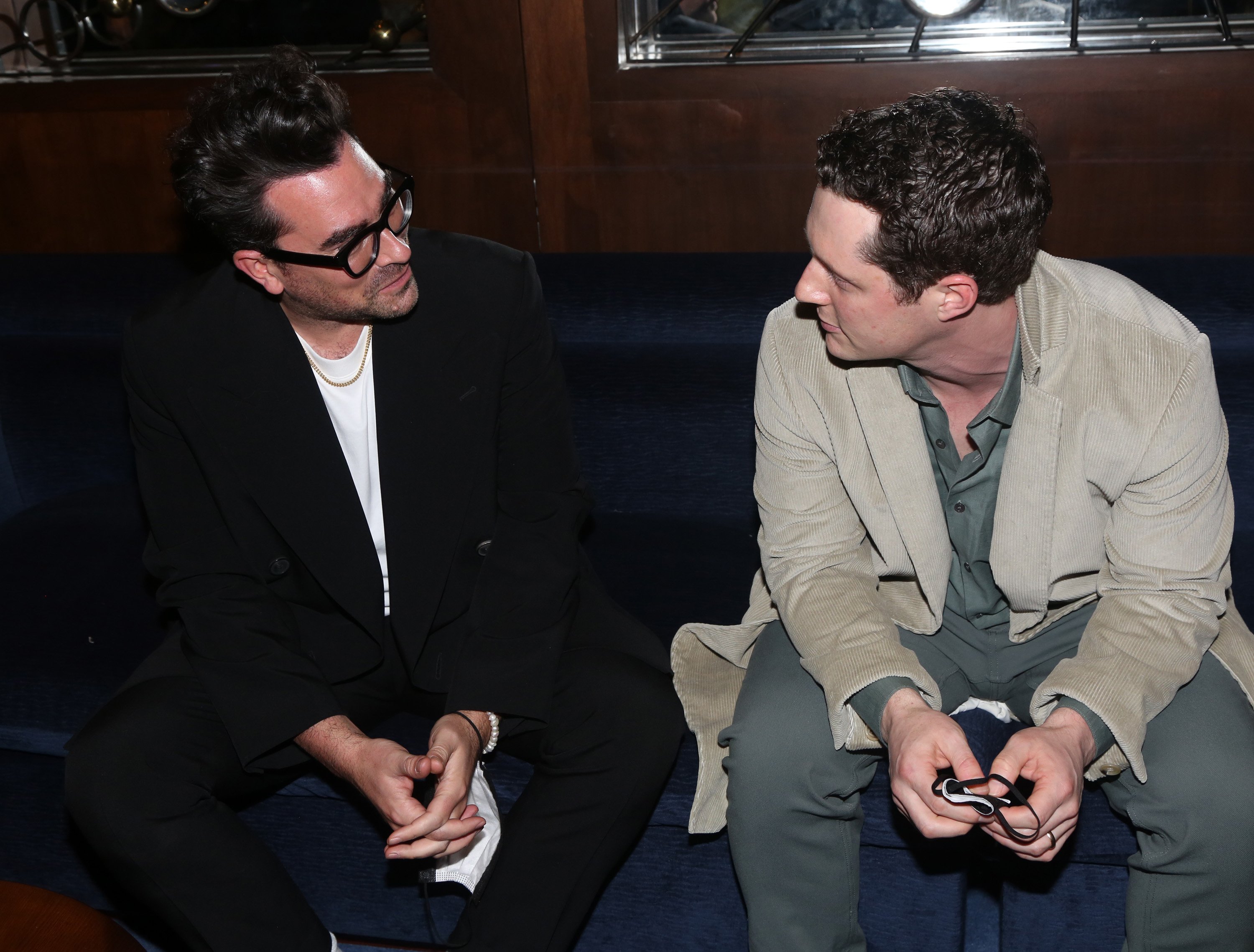 Dan Levy and Noah Reid chatting backstage at the opening night of "The Minutes" on Broadway in New York City | Source: Getty Images