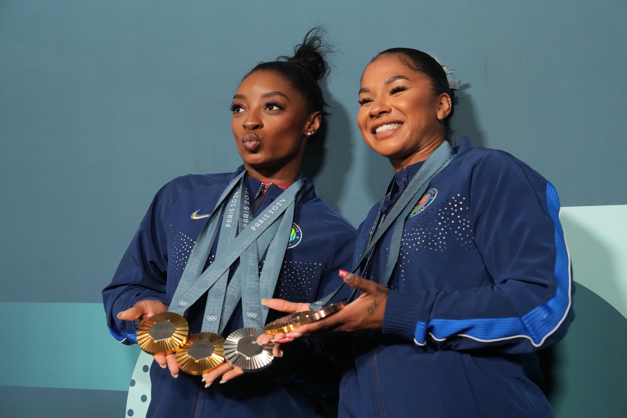 Simone Biles and Jordan Chiles posing with their medals following the Women's Floor Exercise Final at Bercy Arena | Source: Getty Images