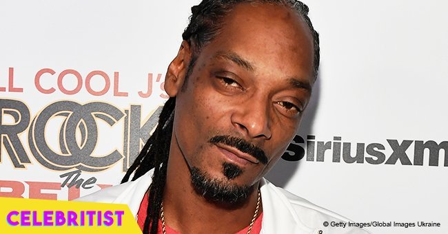 Snoop Dogg's grown up daughter flaunts blonde hair in mini shorts & blue coat in new photos