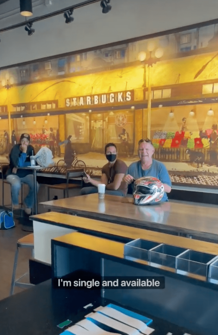 Customers sit inside of a Starbucks cafe as a customer tells people that she is single and available | Photo: TikTok/rosette_luve