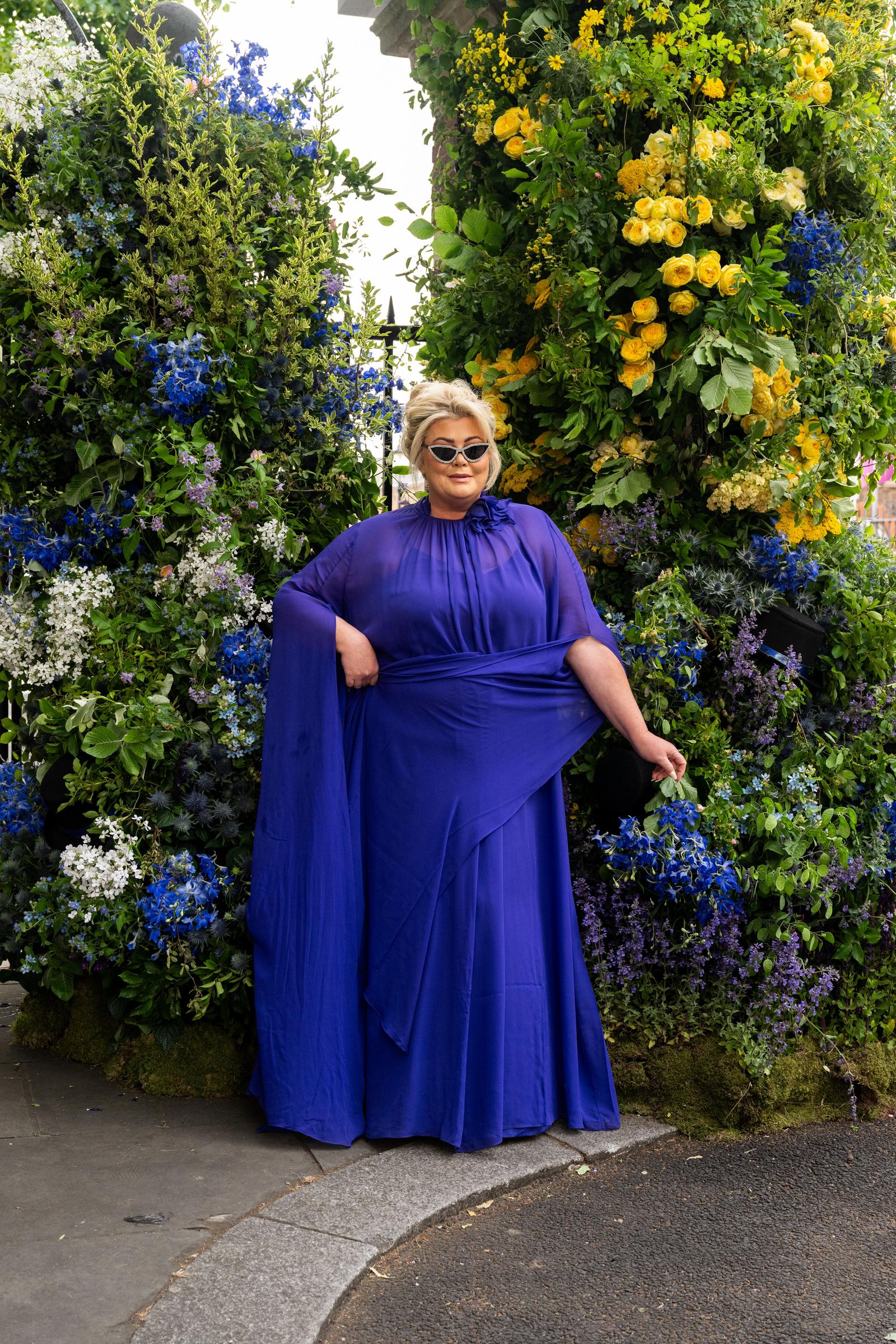Gemma Collins wears a Marina Rinaldi dress and diamante sunglasses at the Chelsea Flower Show on 19 May 2025 in London, England. | Source: Getty Images