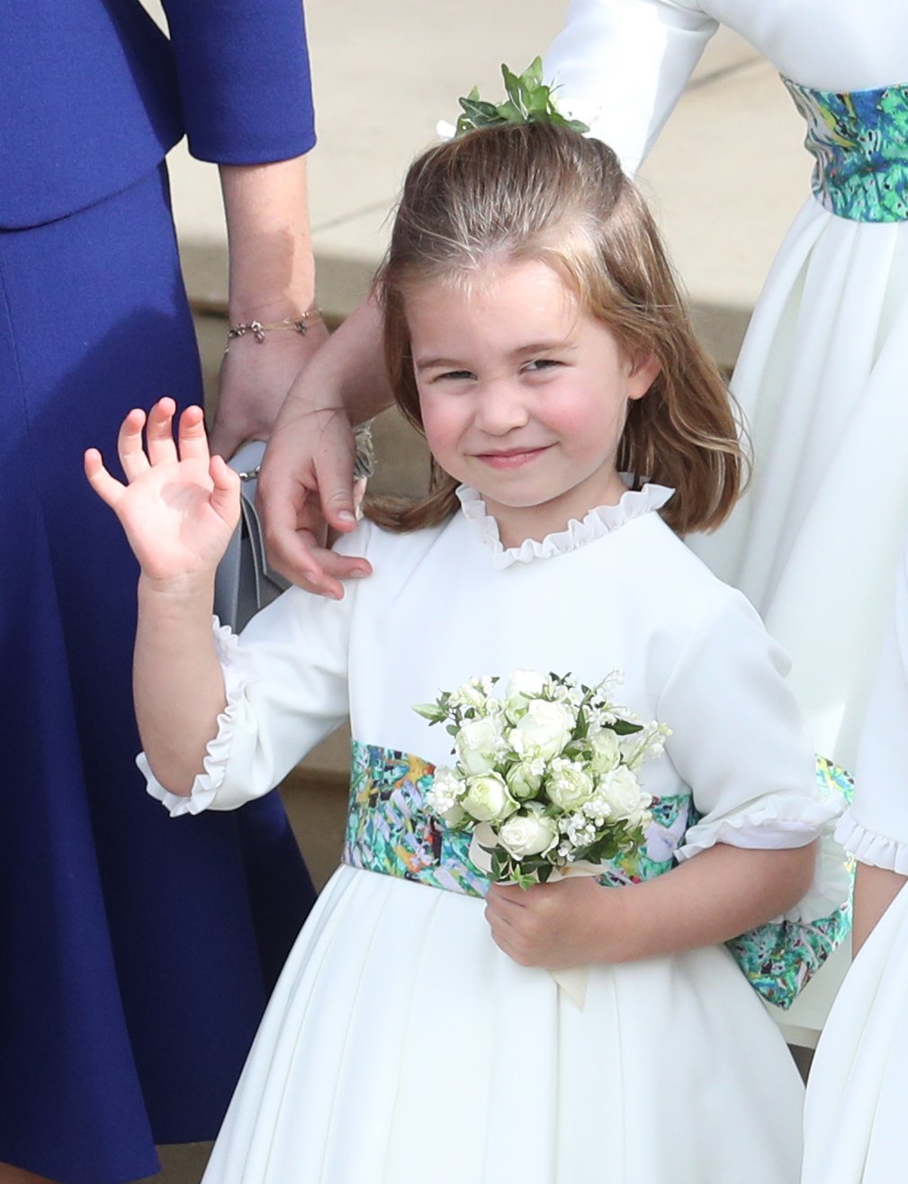 Princess Charlotte waves to cameras at Princess Eugenie's wedding at St. George's Chapel in Windsor Castle, Windsor, England on October 12, 2018 | Photo: Getty Images