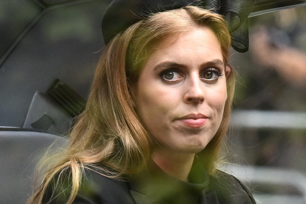 Princess Beatrice of York follows the coffin of Queen Elizabeth II, draped in the Royal Standard, as it travels on the State Gun Carriage of the Royal Navy from Westminster Abbey to Wellington Arch on 19 September 2022 in London, England. | Source: Getty Images