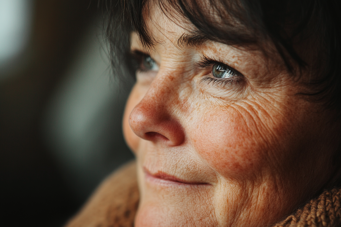 An emotional woman smiling | Source: Midjourney