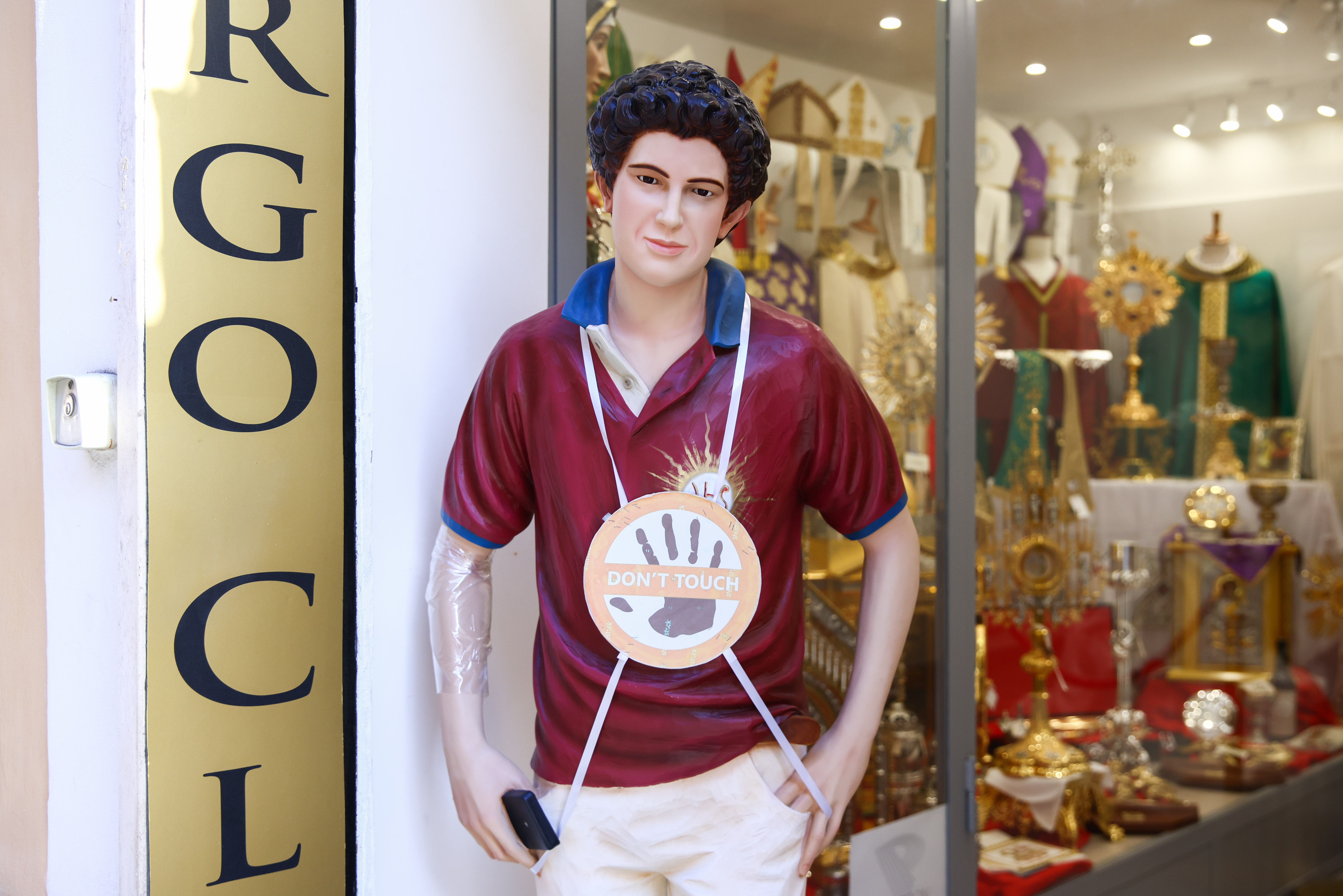 A statue of Carlo Acutis is seen outside a religious shop a day ahead of the conclave on May 6, 2025 in Vatican City, Italy | Source: Getty Images