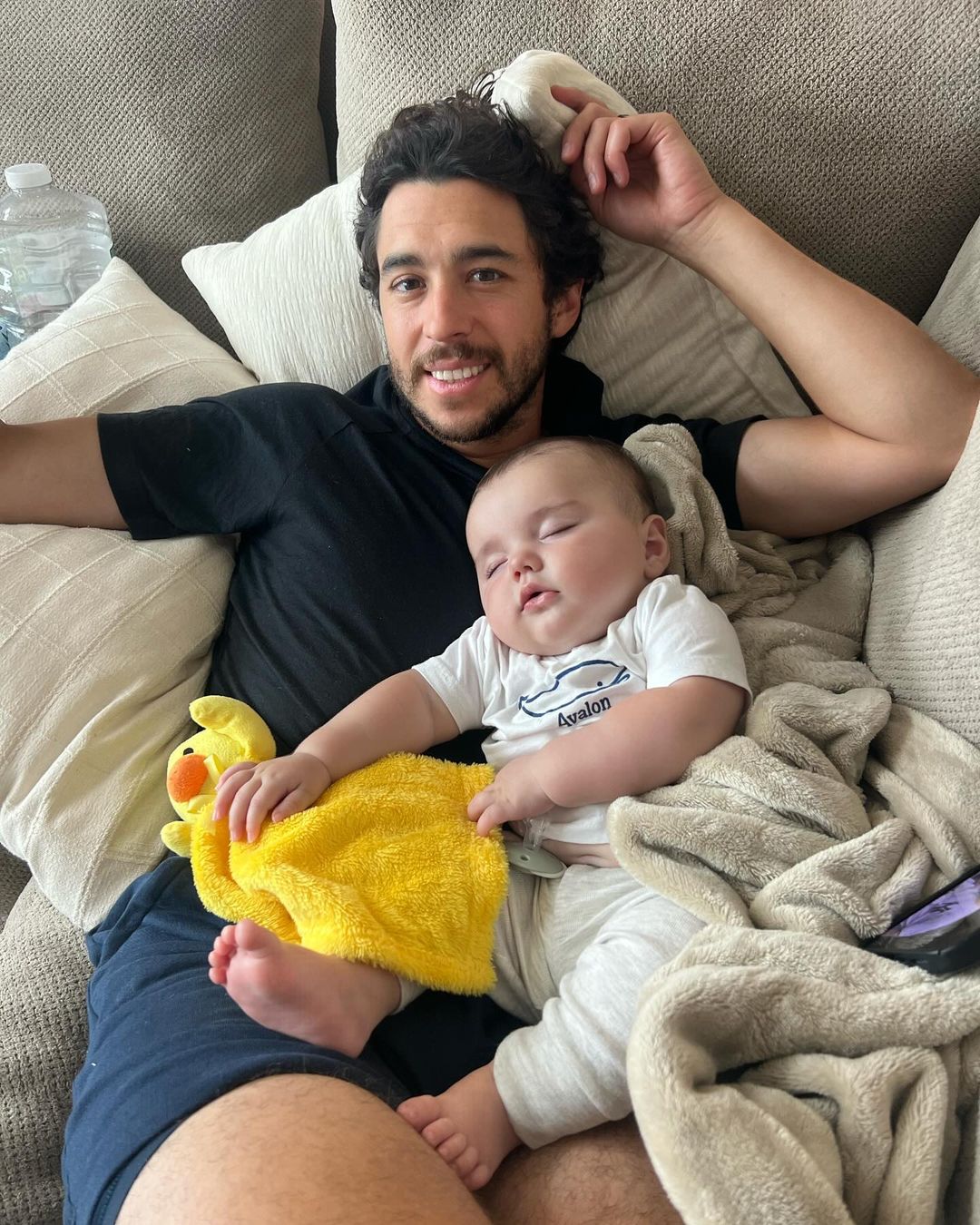 Johnny with baby Johnny Gaudreau as he naps peacefully, from an Instagram slideshow of pictures, dated September 1, 2024 | Source: Instagram/meredithgaudreau_