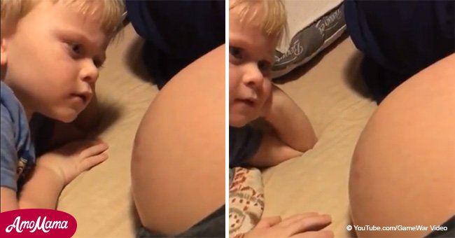 Boy talks to mom’s baby bump and is surprised to receive a response