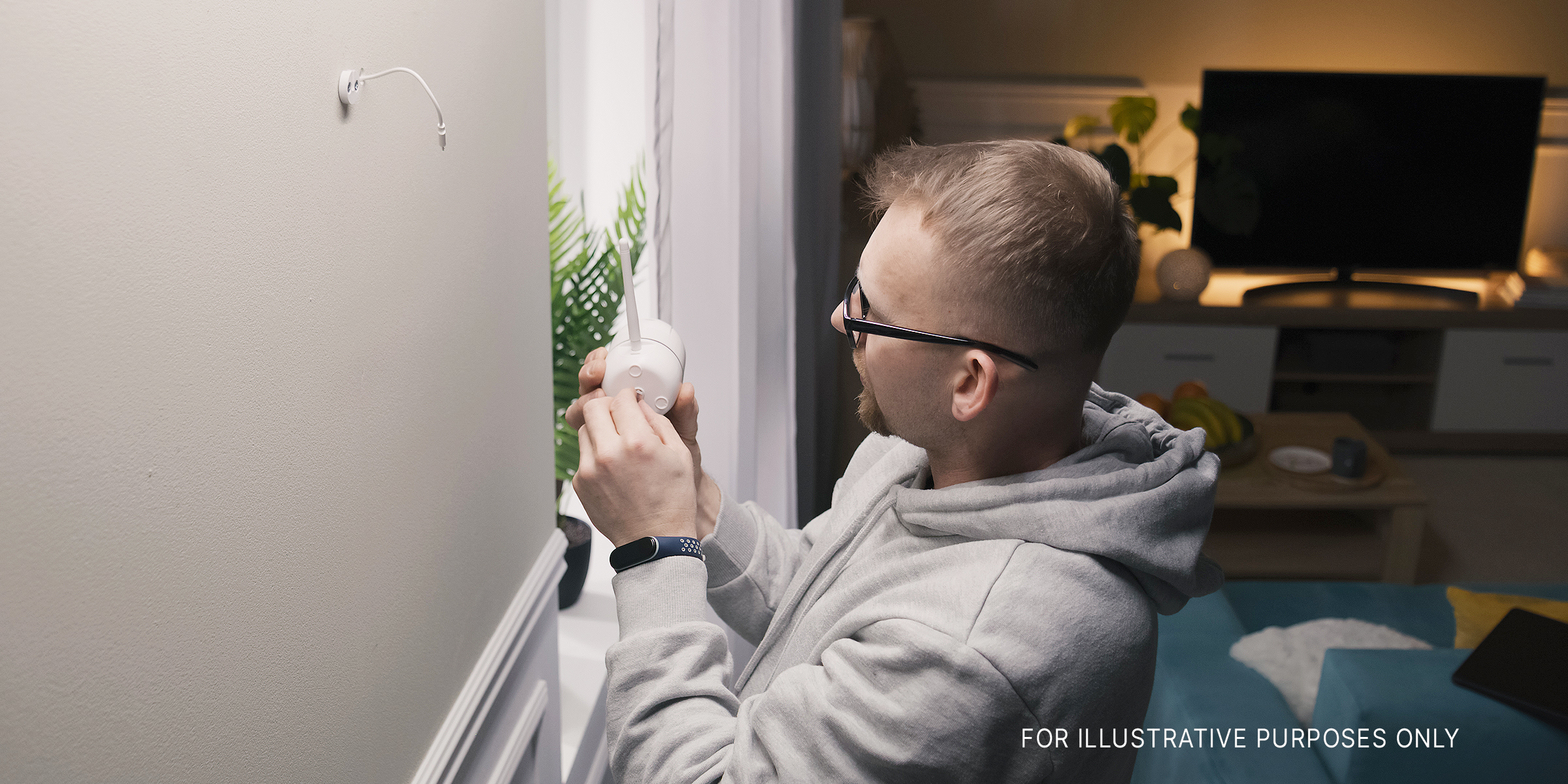 A man installing hidden cameras | Source: Shutterstock