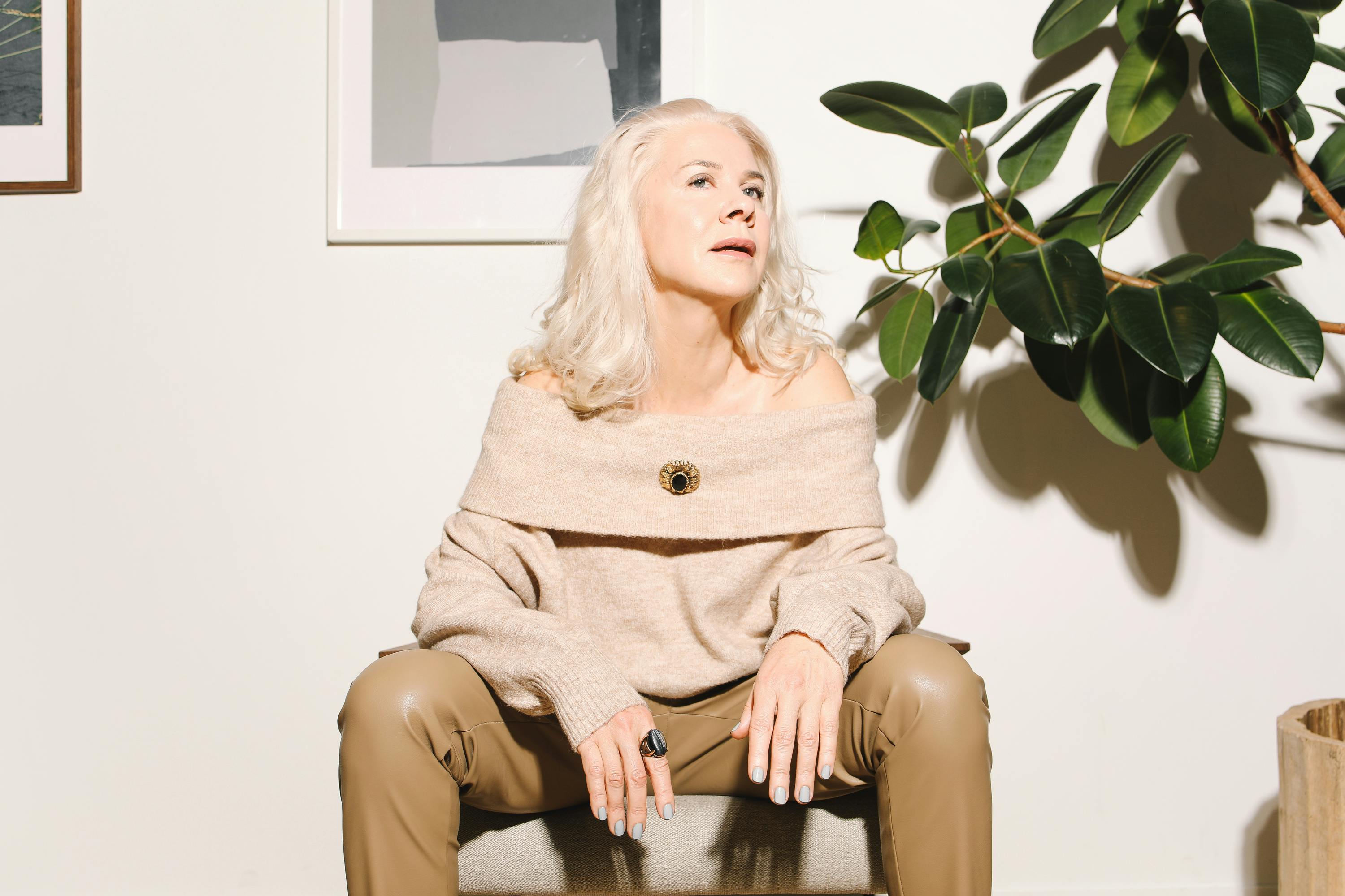 Stylish woman sitting on a chair | Source: Pexels