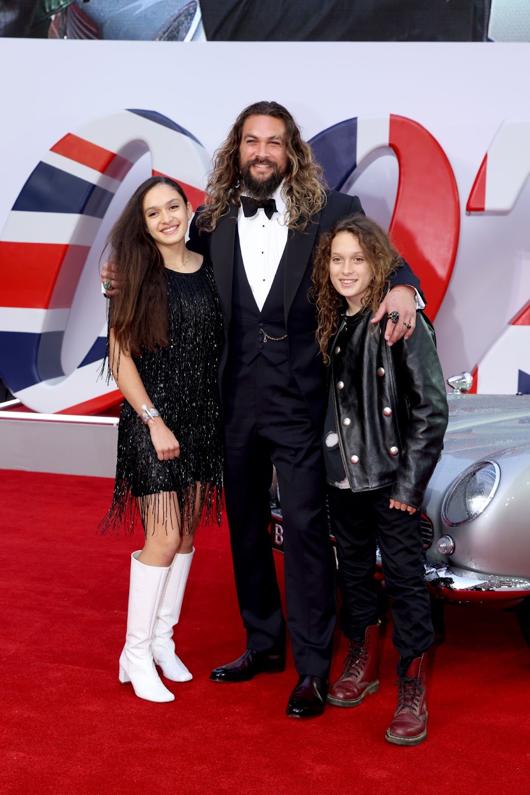 Lola Lolani, Jason Momoa, and Nakoa-Wolf Momoa attended the premiere of "No Time to Die" on September 28, 2021, in London, England. Jason shared this special red carpet moment with his children, who continue to support of their father's high-profile events. | Source: Getty Images