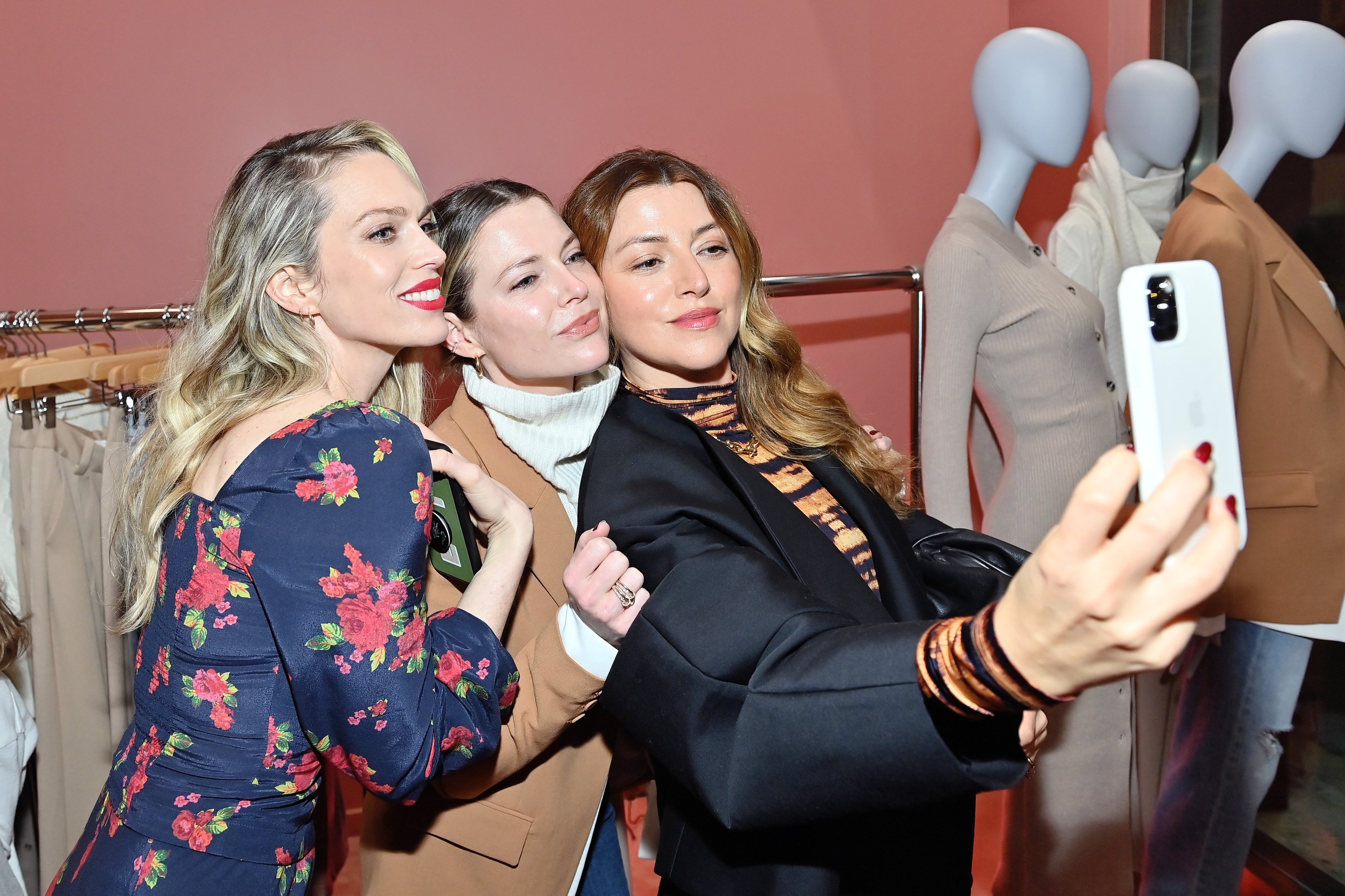 Erin Foster, Jordan Foster and Sara Riff pose for a selfie at the Favorite Daughter Store Opening hosted by Sara and Erin Foster on December 13, 2021, in Beverly Hills, California | Source: Getty Images