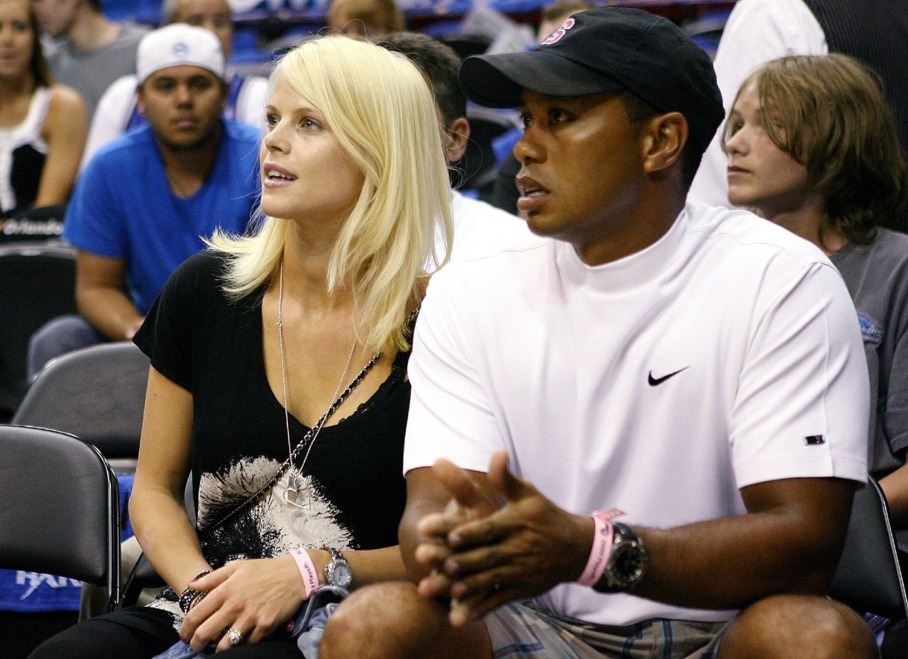 Tiger Woods sits courtside with his wife Elin during Game Four of the 2009 NBA Finals between the Los Angeles Lakers and the Orlando Magic. | Source: Getty Images 
