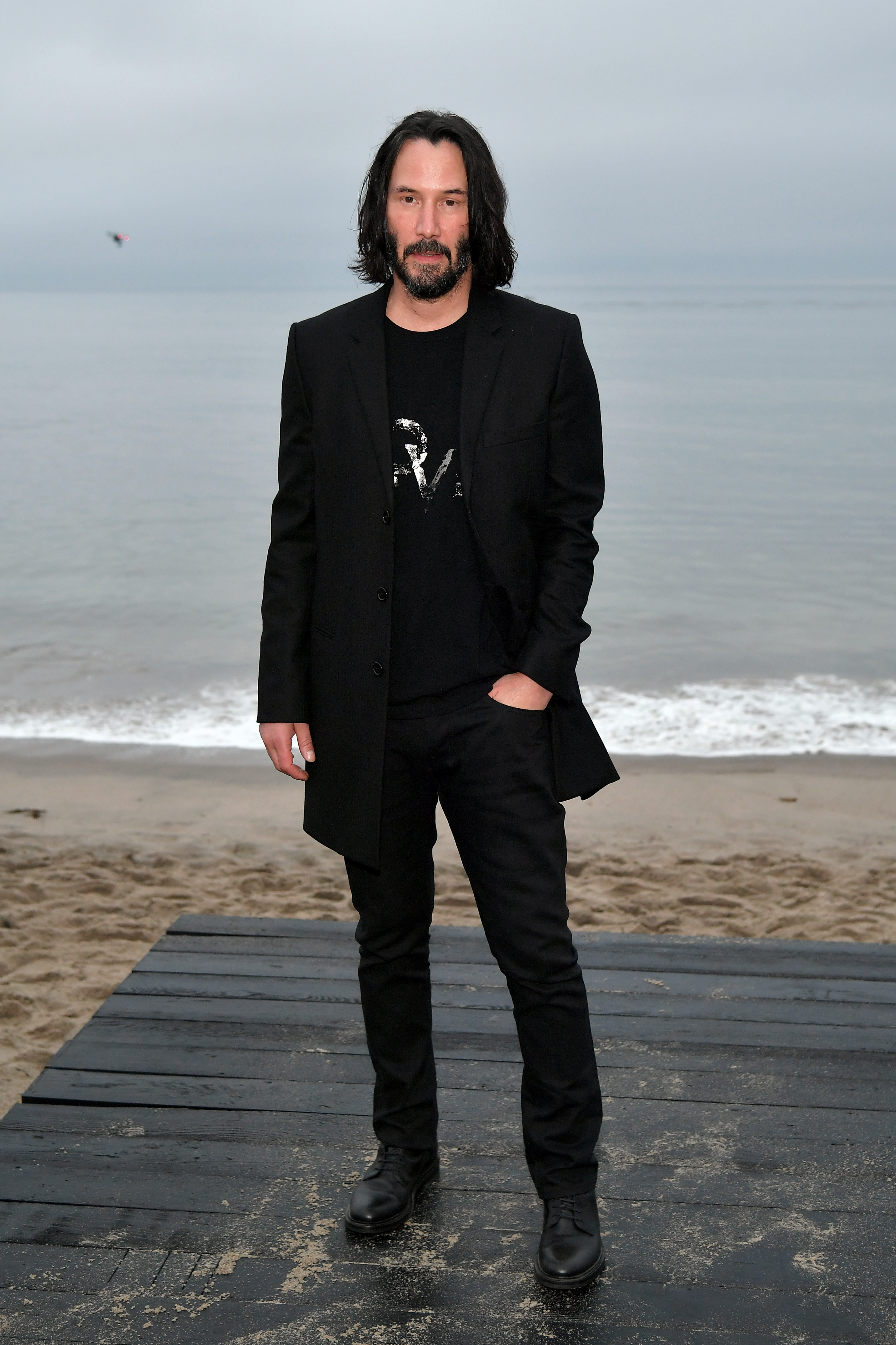 Keanu Reeves at the Saint Laurent Mens Spring Summer 20 Show on June 6, 2019 in Paradise Cove Malibu, California | Source: Getty Images