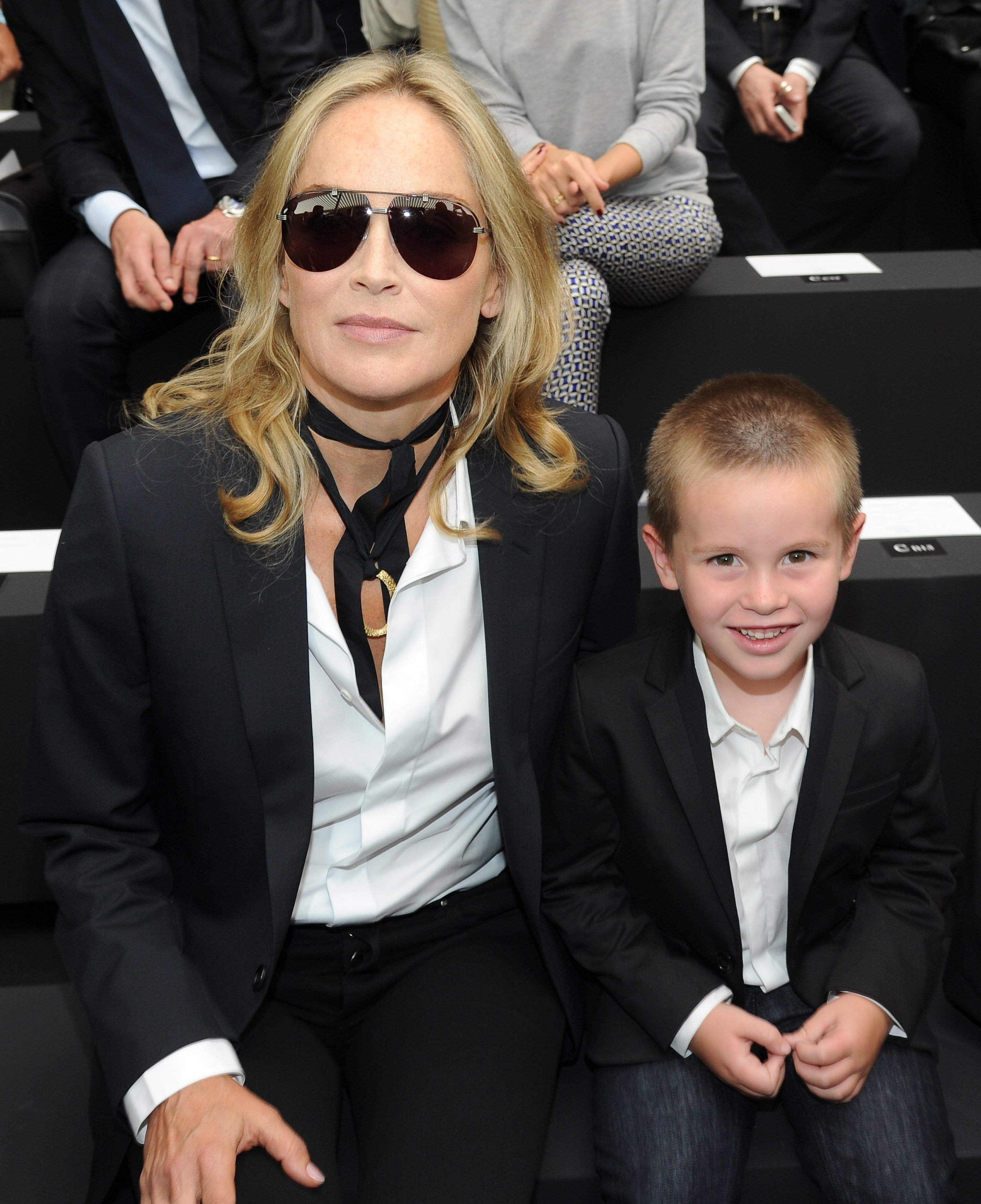 Sharon Stone at the Dior Homme Menswear Spring / Summer 2013 show with her youngest son Quinn | Photo: Getty Images