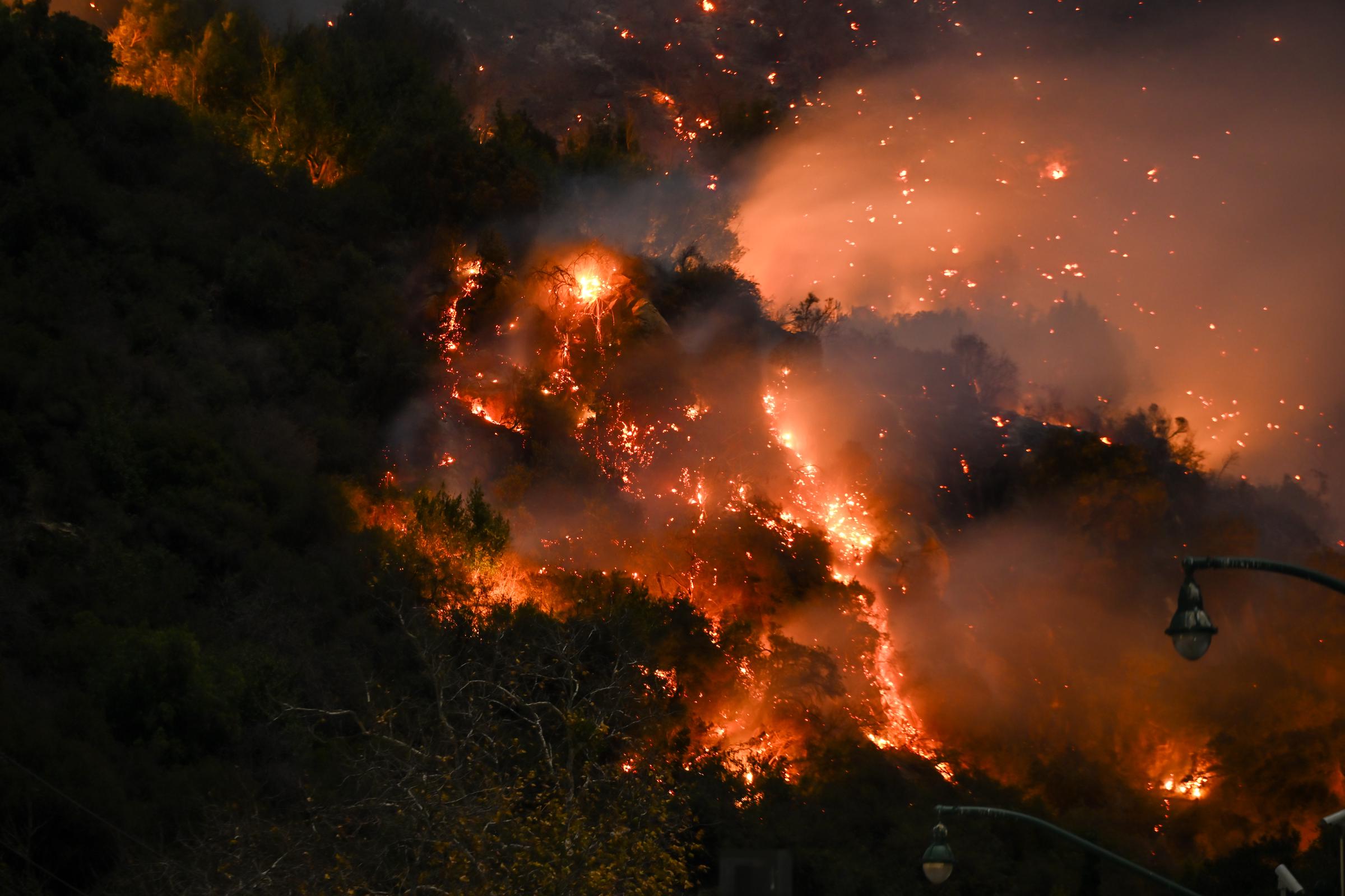 The Eaton Fire burning a mountain in Los Angeles, California on January 9, 2025. | Source: Getty Images