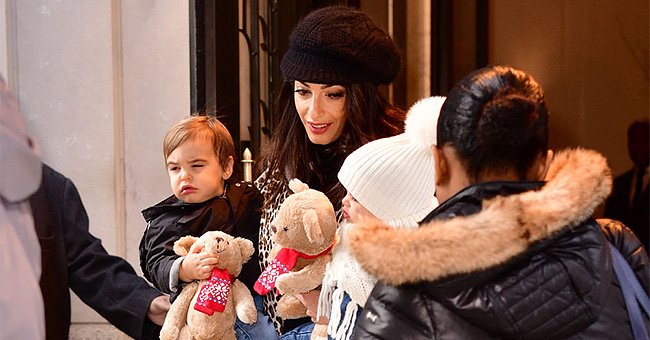 Amal Clooney seen with her children Alexander and Ella Clooney on December 6, 2018, in New York City | Photo: James Devaney/GC Images/Getty Images