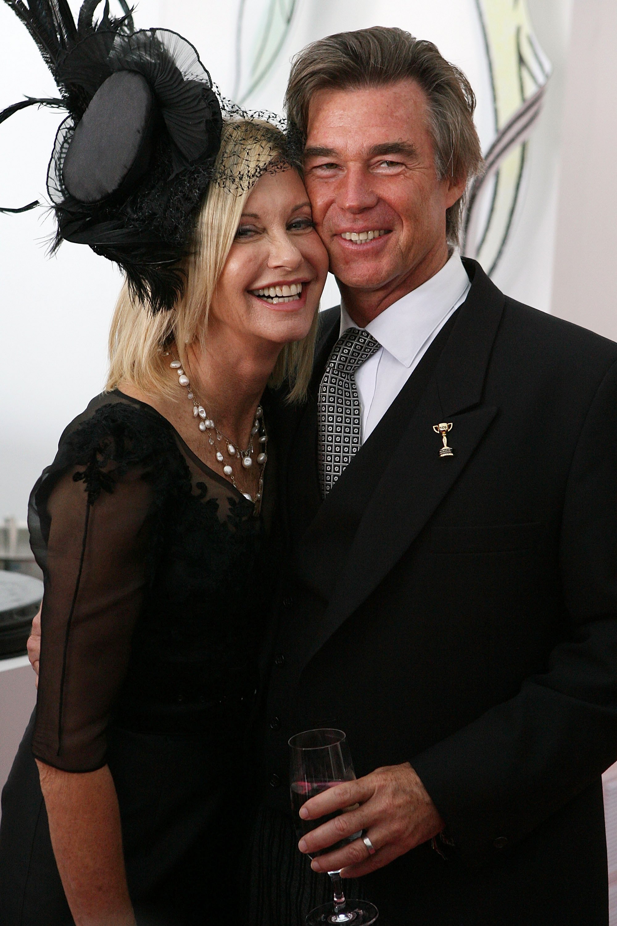 Olivia Newton-John and husband John Easterling attend Emirates Melbourne Cup Day at Flemington Racecourse. November 3, 2009. | Source: Getty Images 
