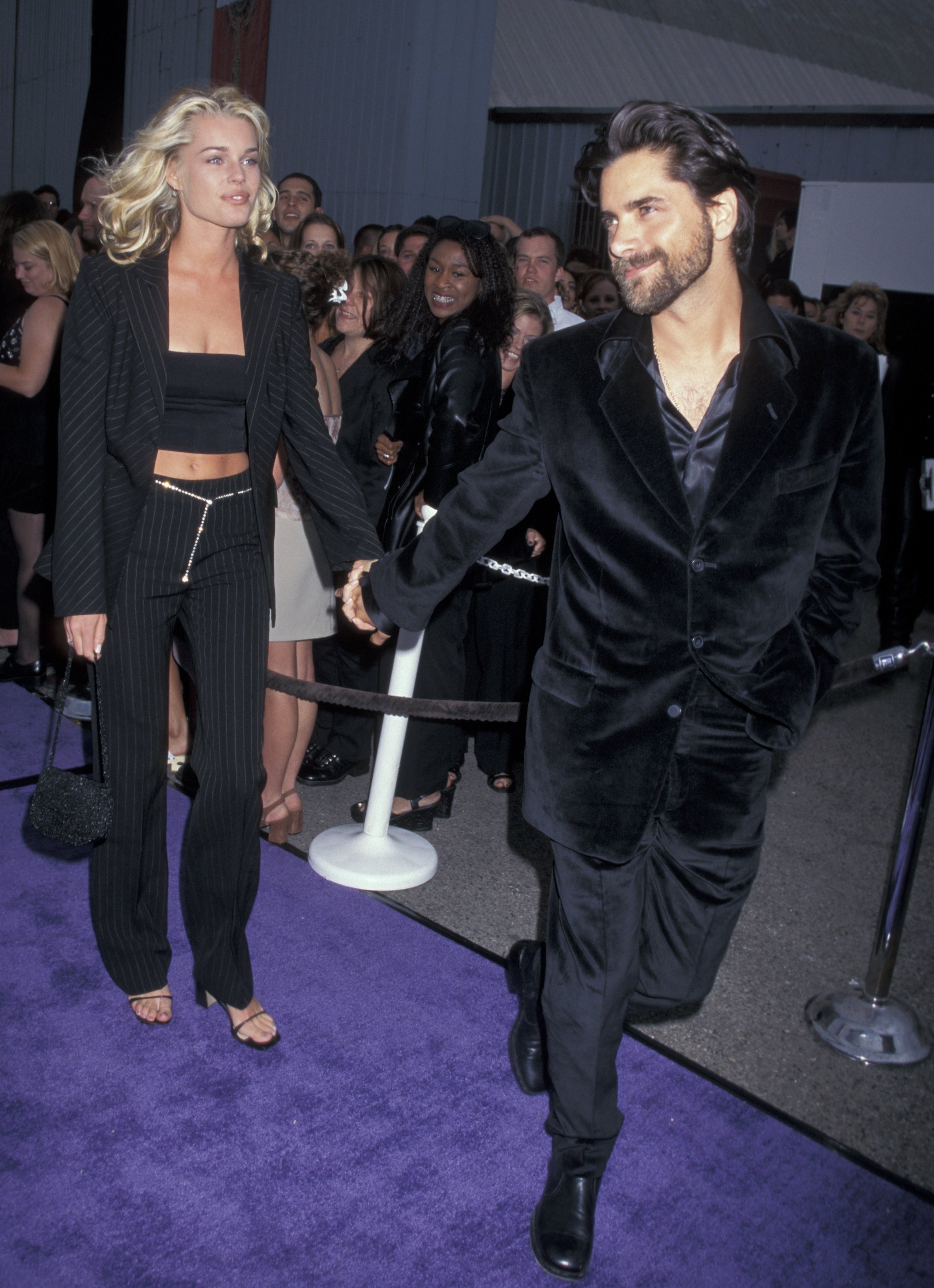 Rebecca Romijn and John Stamos during The 1997 MTV Movie Awards at Barker Hanger in Santa Monica, California, United States | Source: Getty Images 