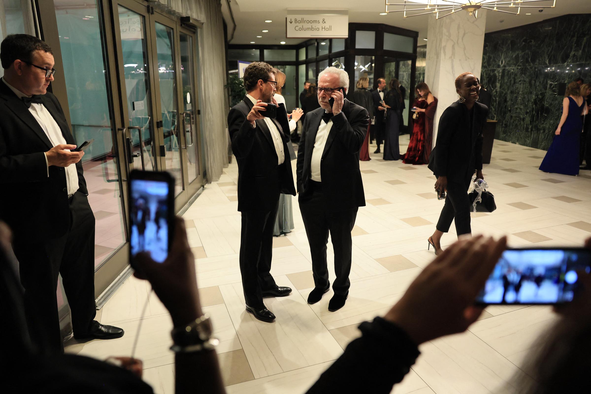 Wolf Blitzer holds his pone after shots were fired during the White House Correspondents' dinner at the Washington Hilton, on April 25, 2026. | Source: Getty Images