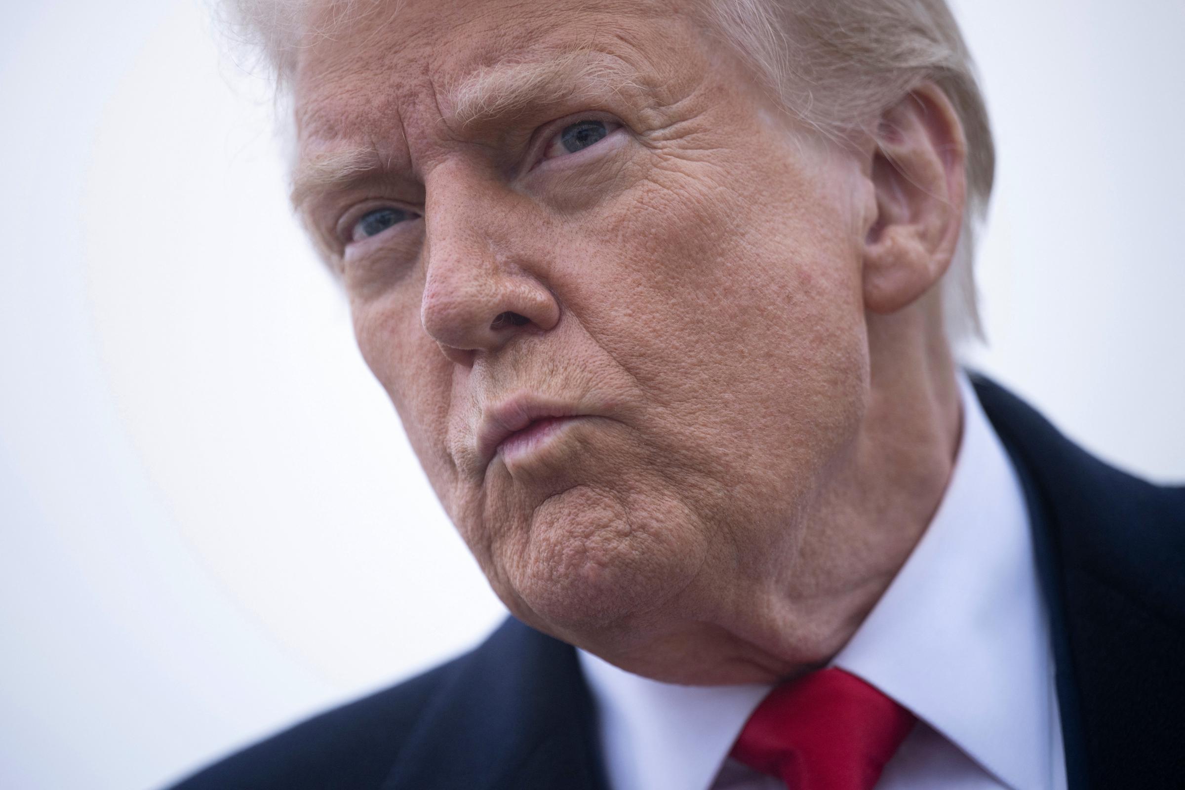 Donald Trump speaks to the press about the conflict in Ukraine before boarding Air Force One at Andrews Air Force Base March 14, 2025, in Maryland | Source: Getty Images