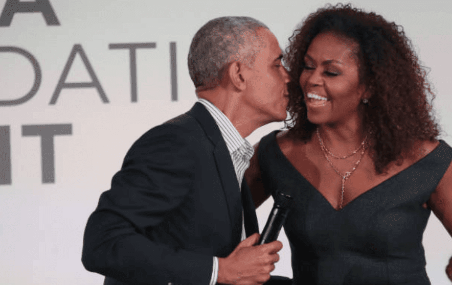 Barack Obama gives his wife Michelle Obama a kiss on the cheek as they end the Obama Foundation Summit at the Illinois Institute of Technology, on October 29, 2019, in Chicago, Illinois | Source: Scott Olson/Getty Images